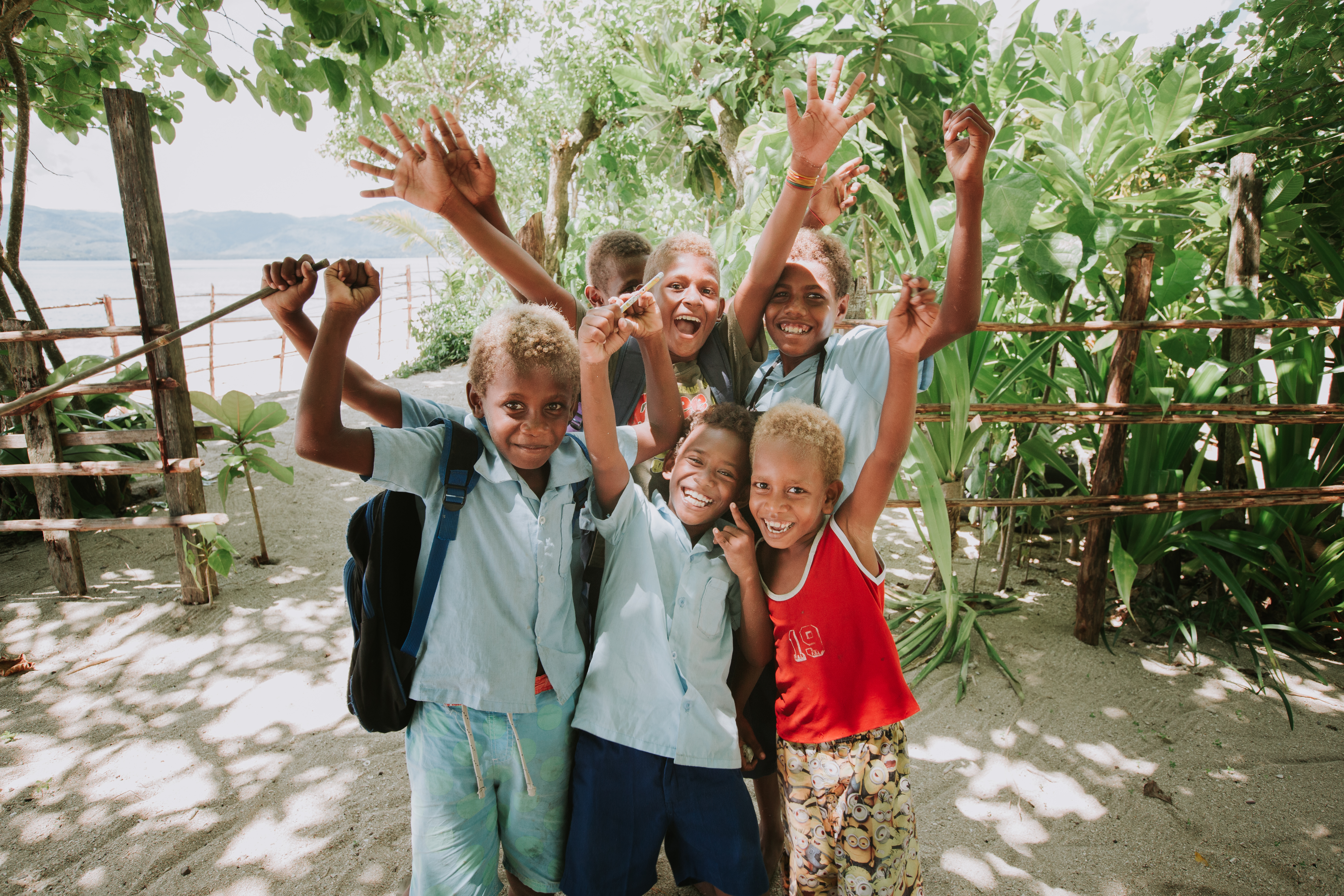 Junior and his friends walking on the Solomon Islands