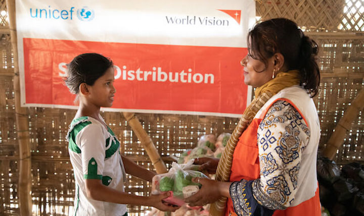 A child collecting coronavirus supplies.
