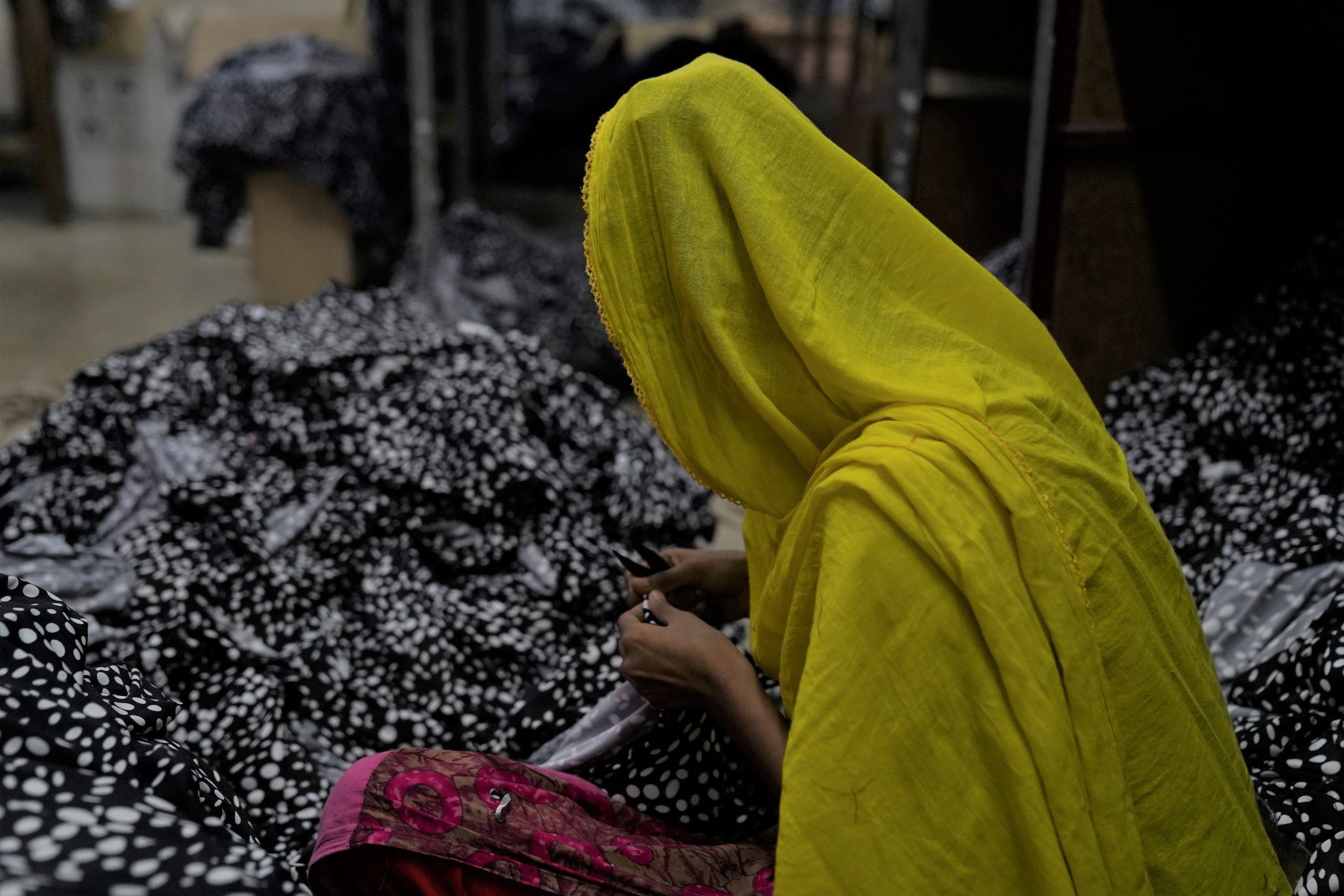 Girl sewing for a living