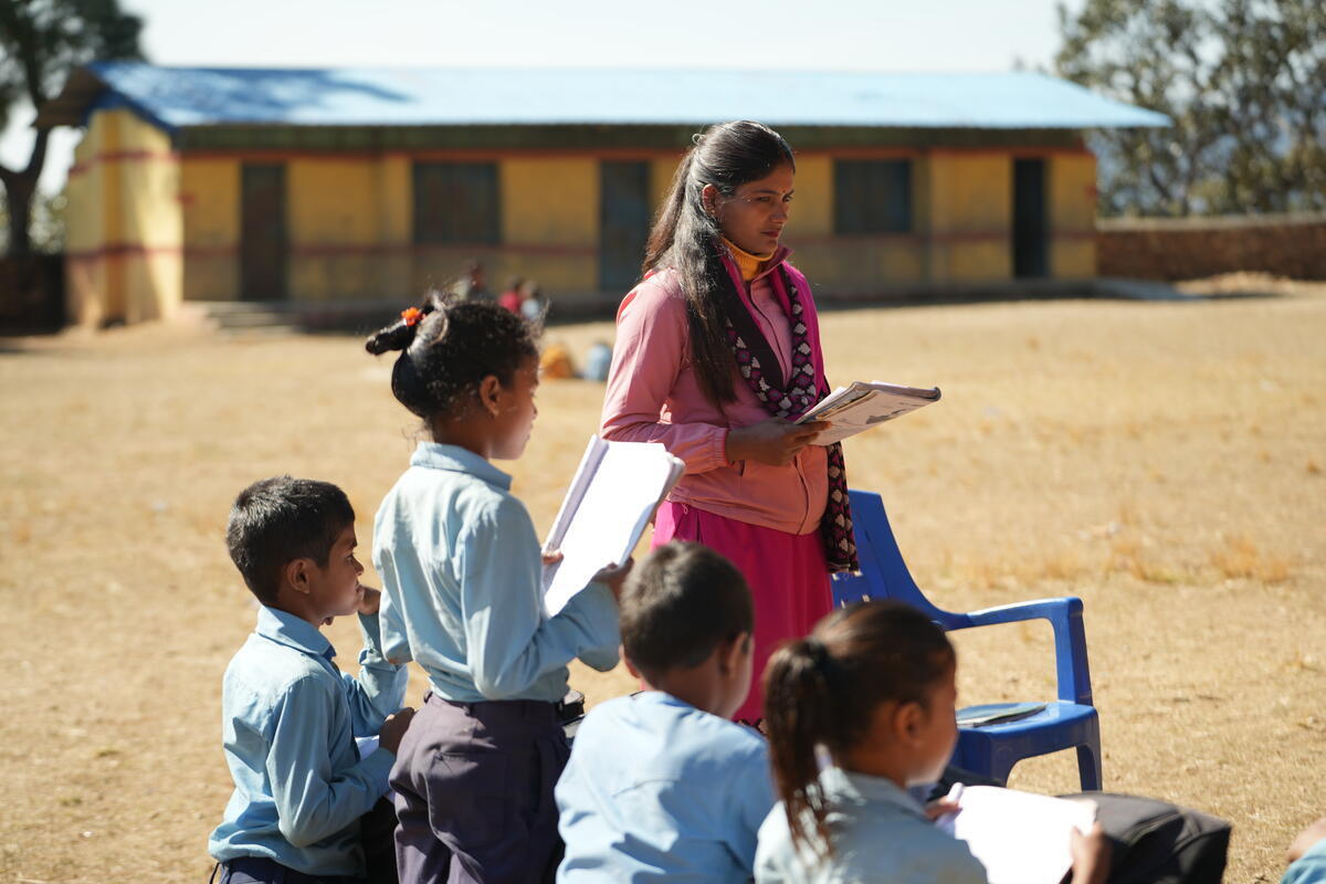 Nepalese children reading at school