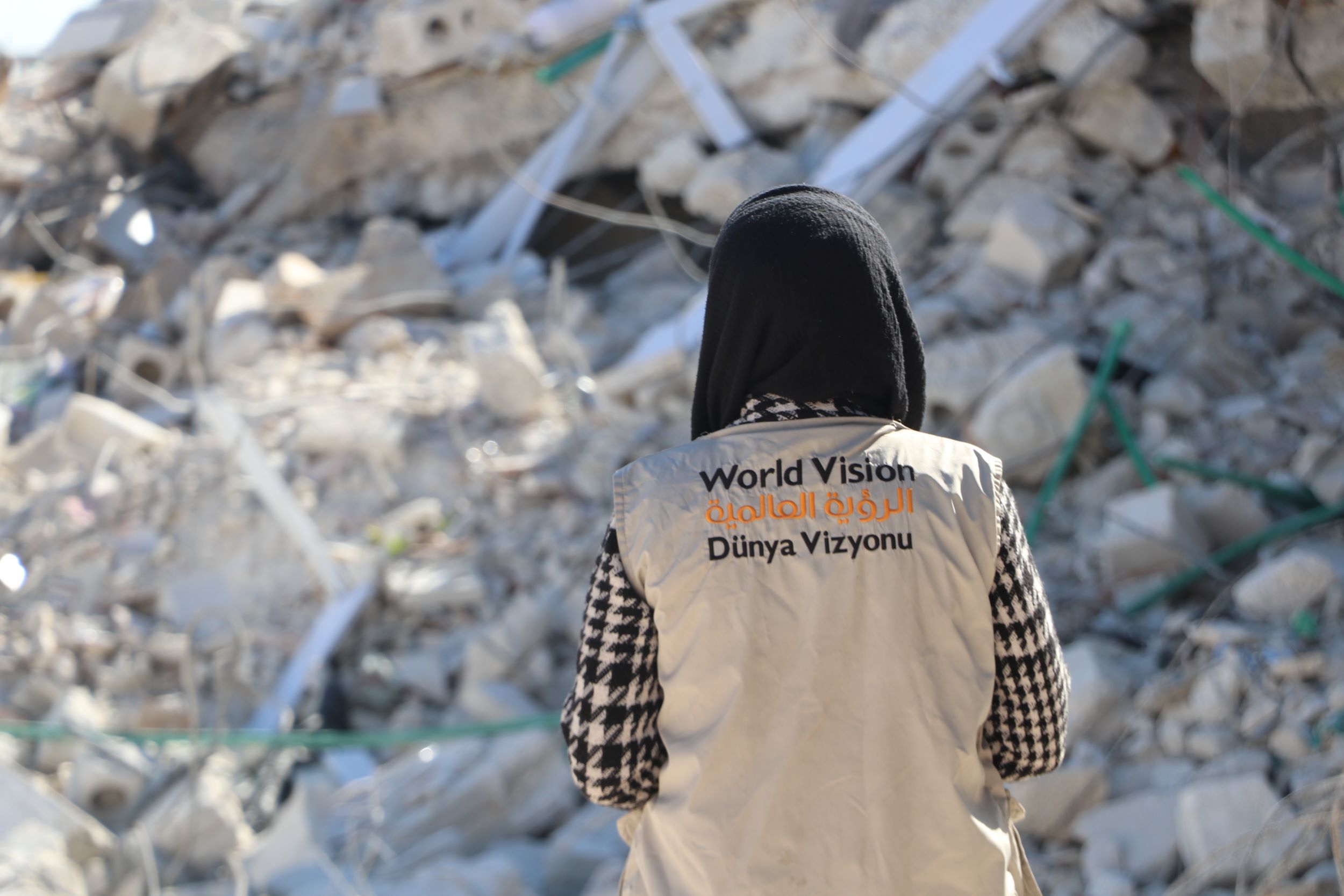 Safa, Syria, looks out at the rubble following the earthquake