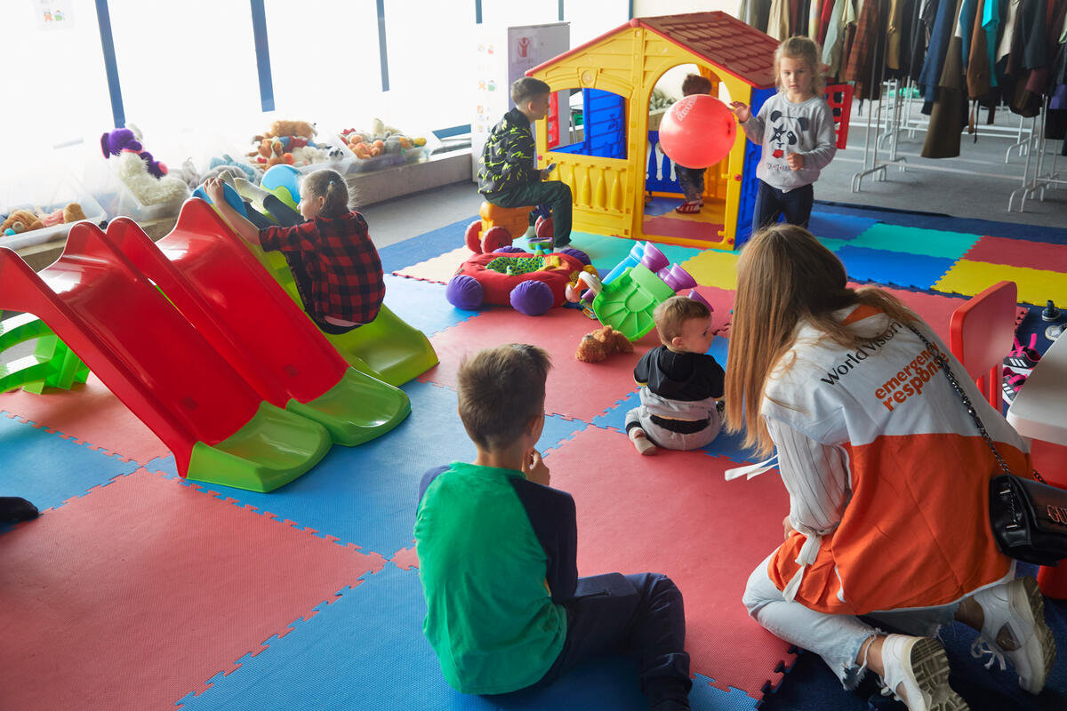 Ukrainian children play in a child friendly space set-up World Vision in the RomExpo Centre 