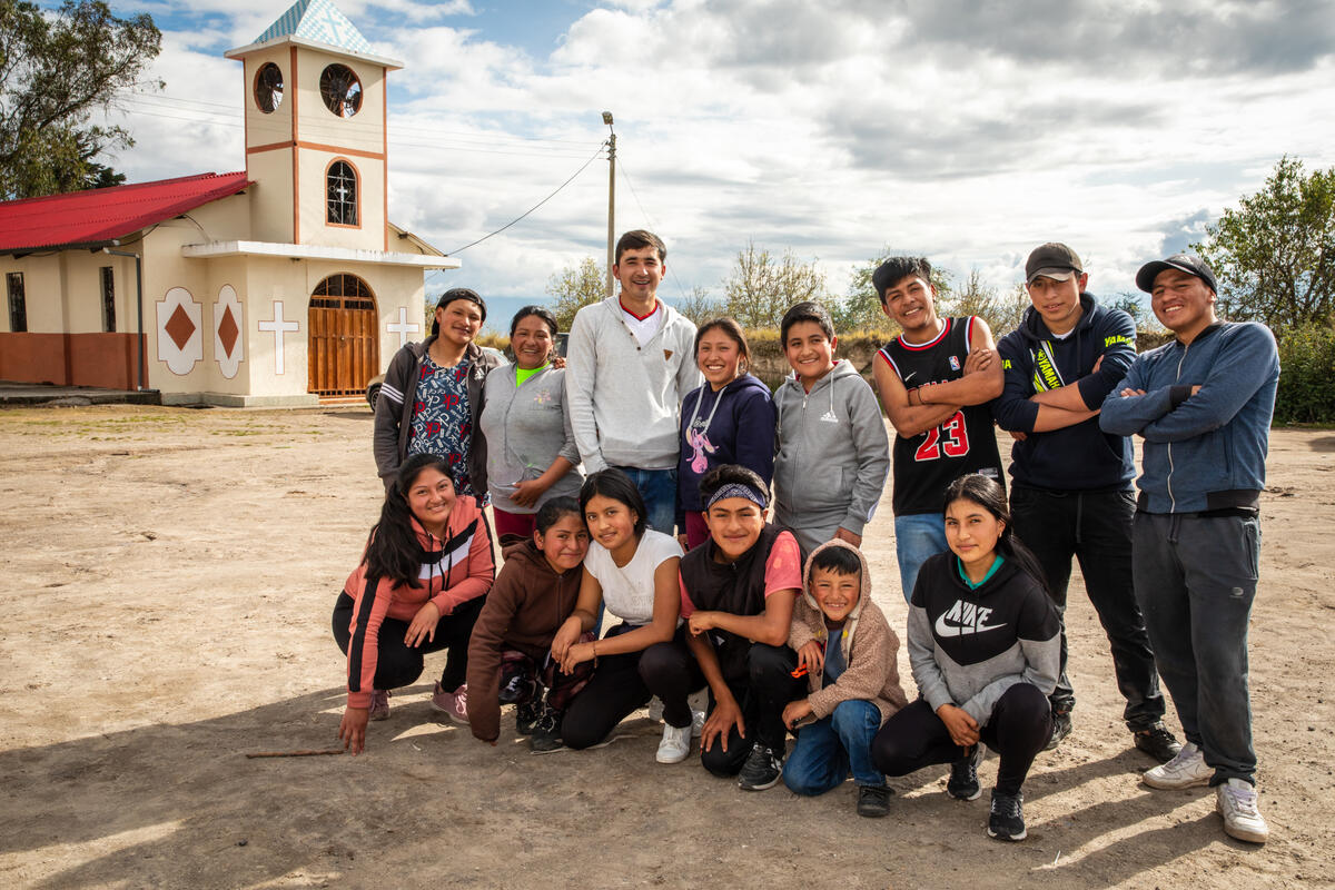 A community dance group in Ecuador, pose for a photo together