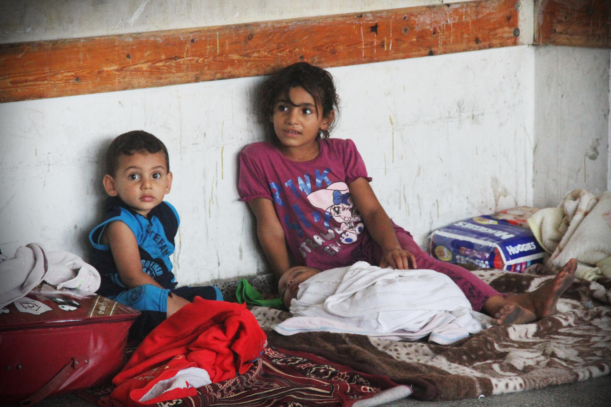 A family from Gaza living in an UNRWA shelter