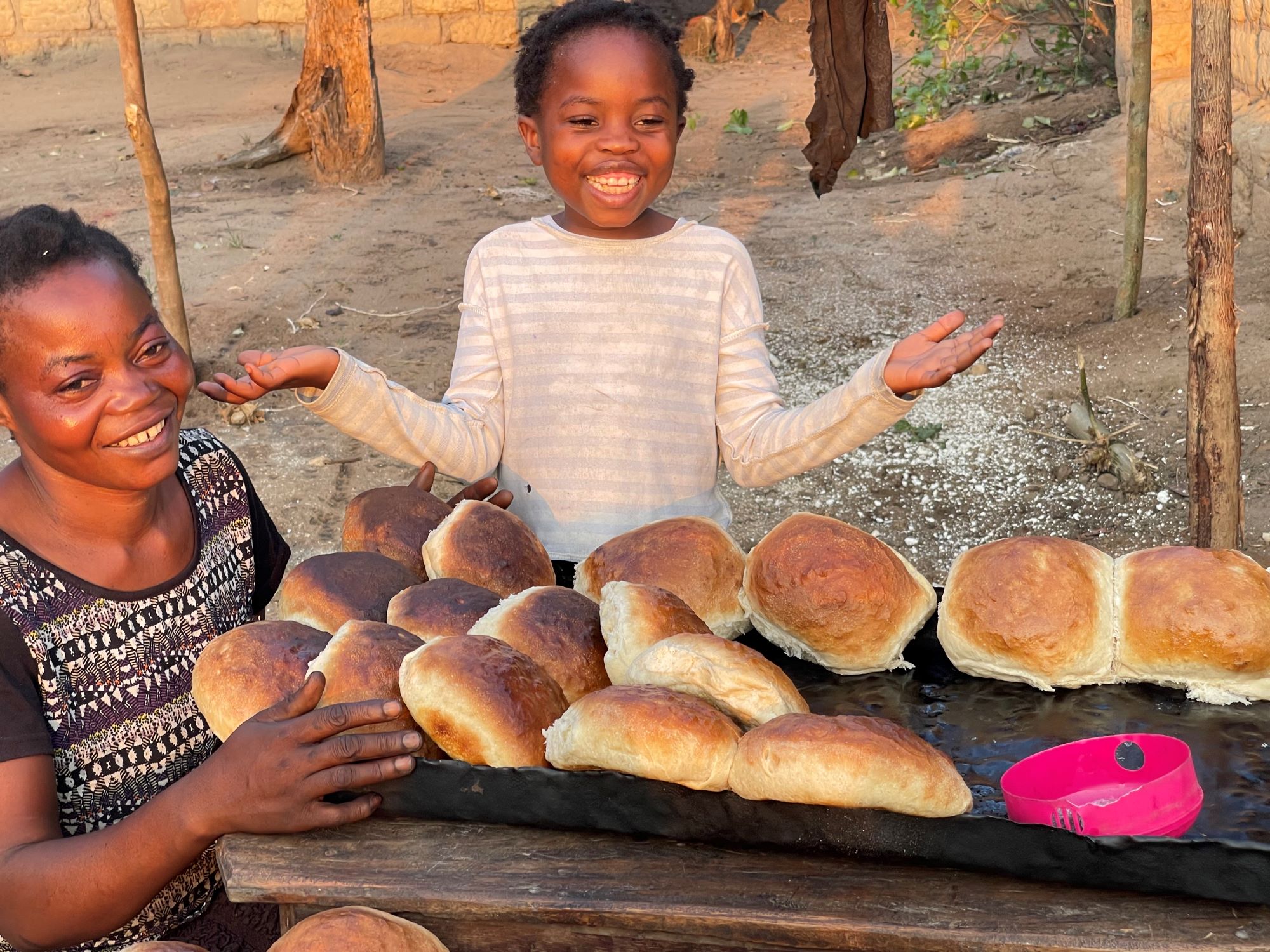 Mother and daughter selling bread in DRC