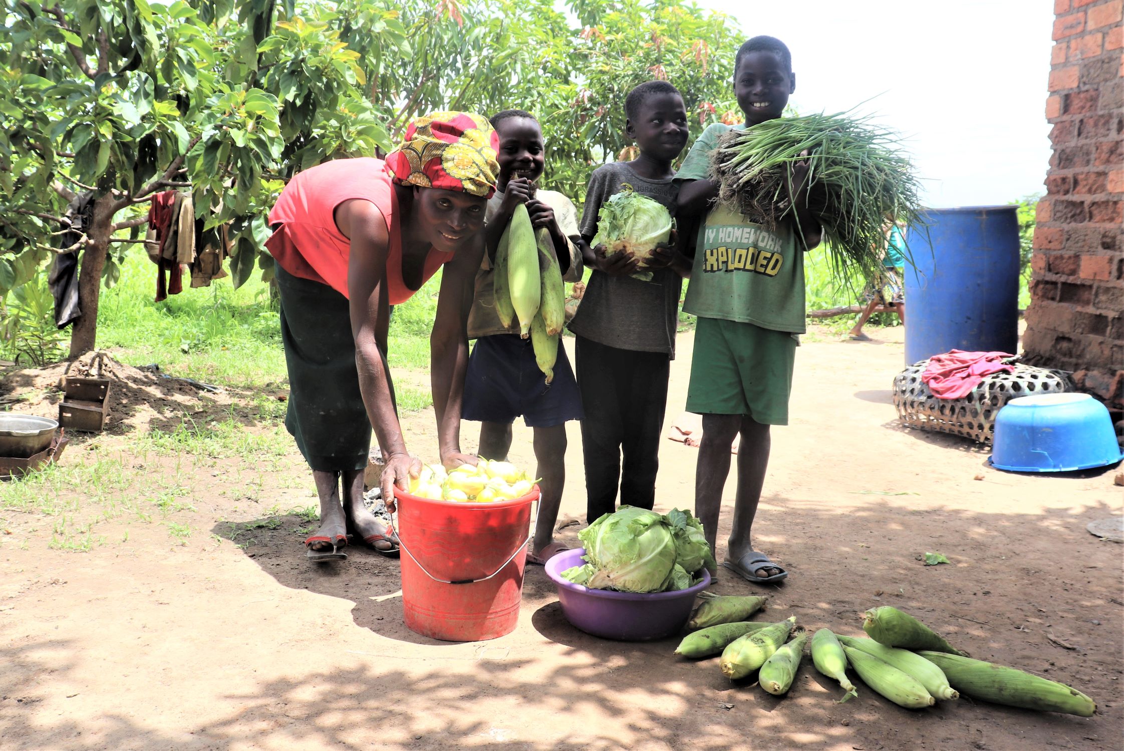 Family with vegetables in Democratic Republic of Congo