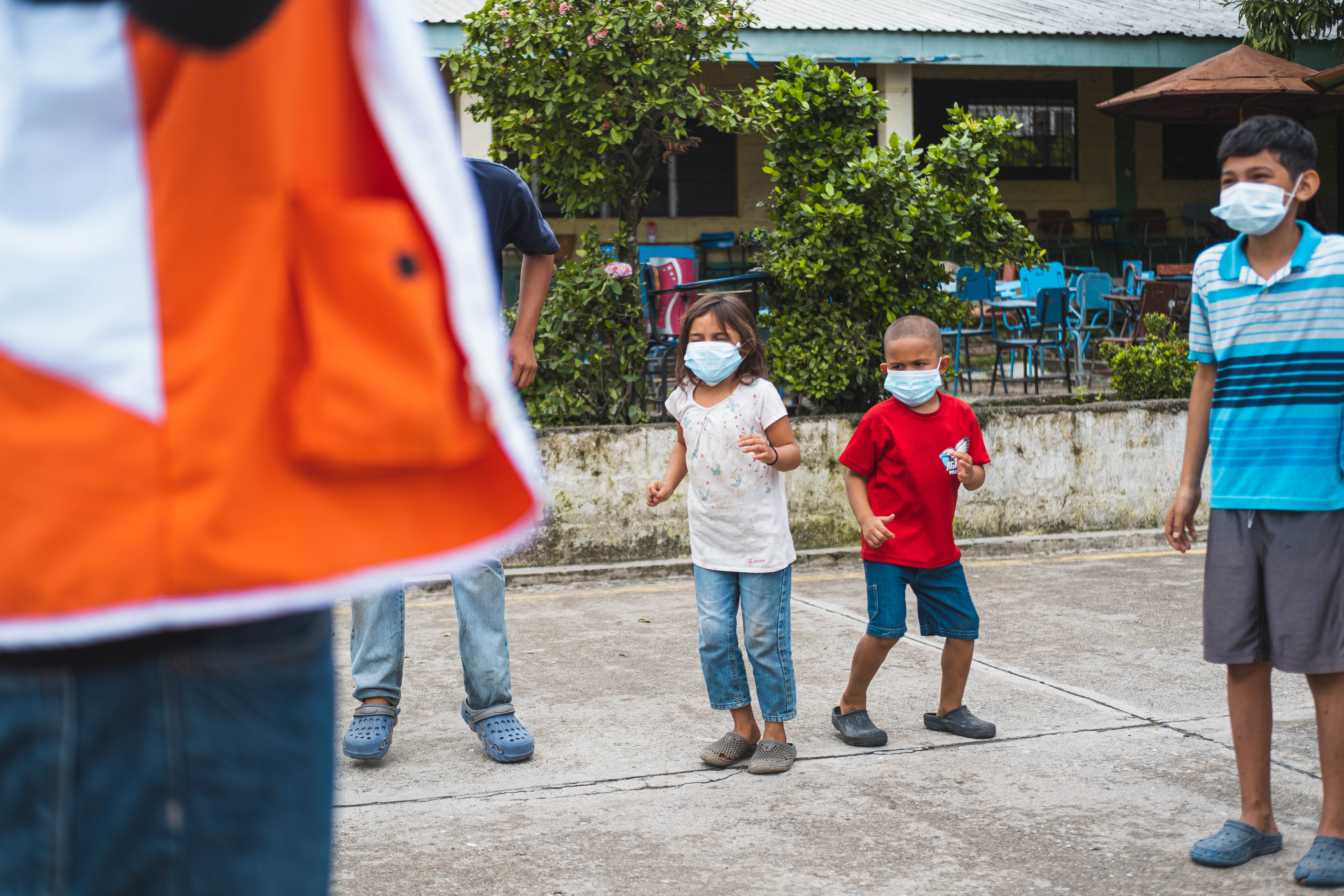 Omar and his sister Lupita are dancing with other children at the Child Friendly Space.