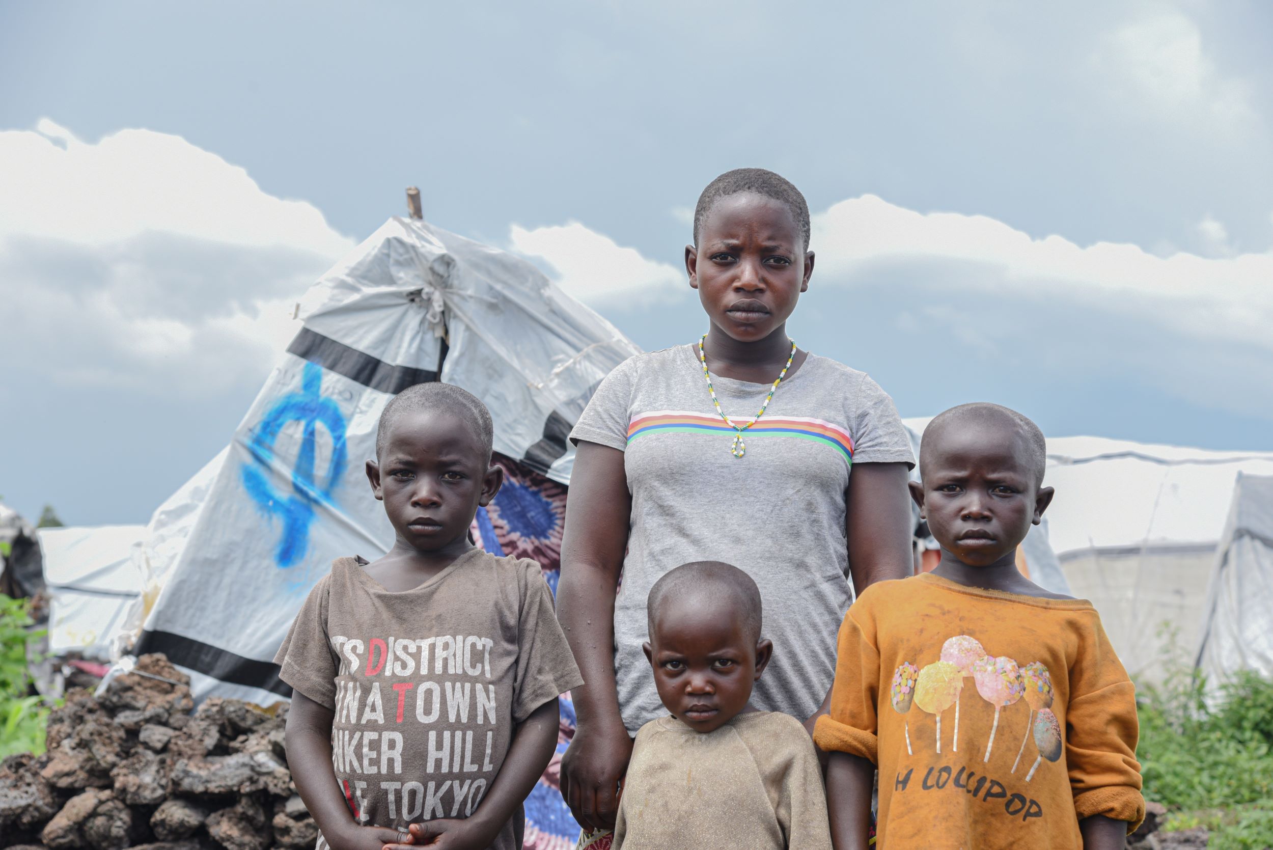 Children and young people of various ages from the DRC stand together