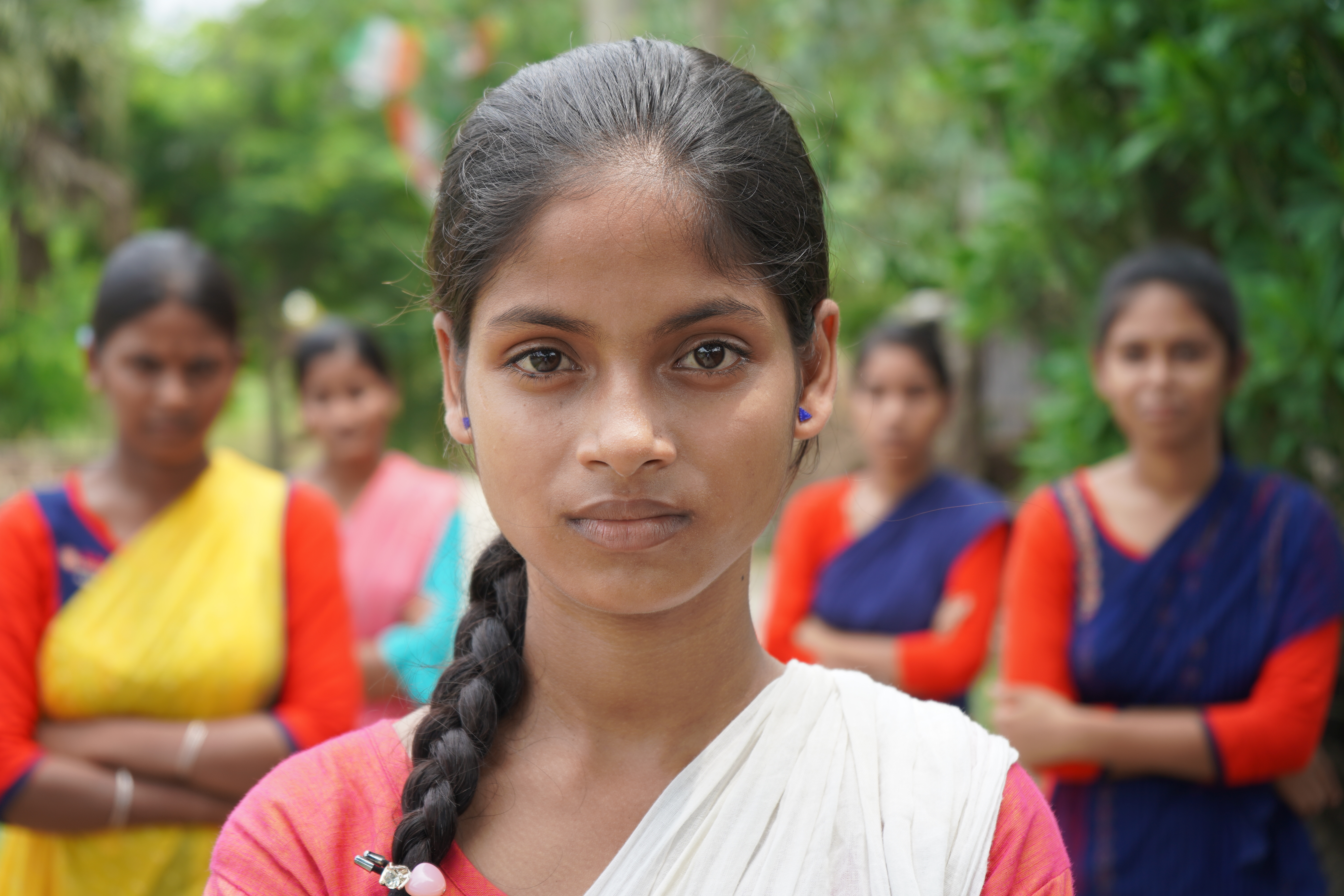 Members of a girls' group in India stand together