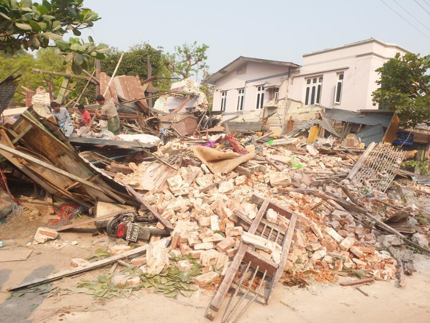A photo showing collapsed buildings and rubble in Myanmar