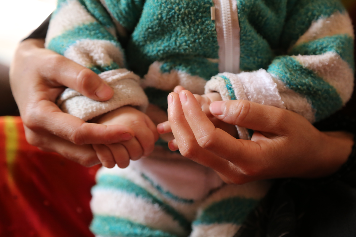 A family grow food in their garden in Kenya
