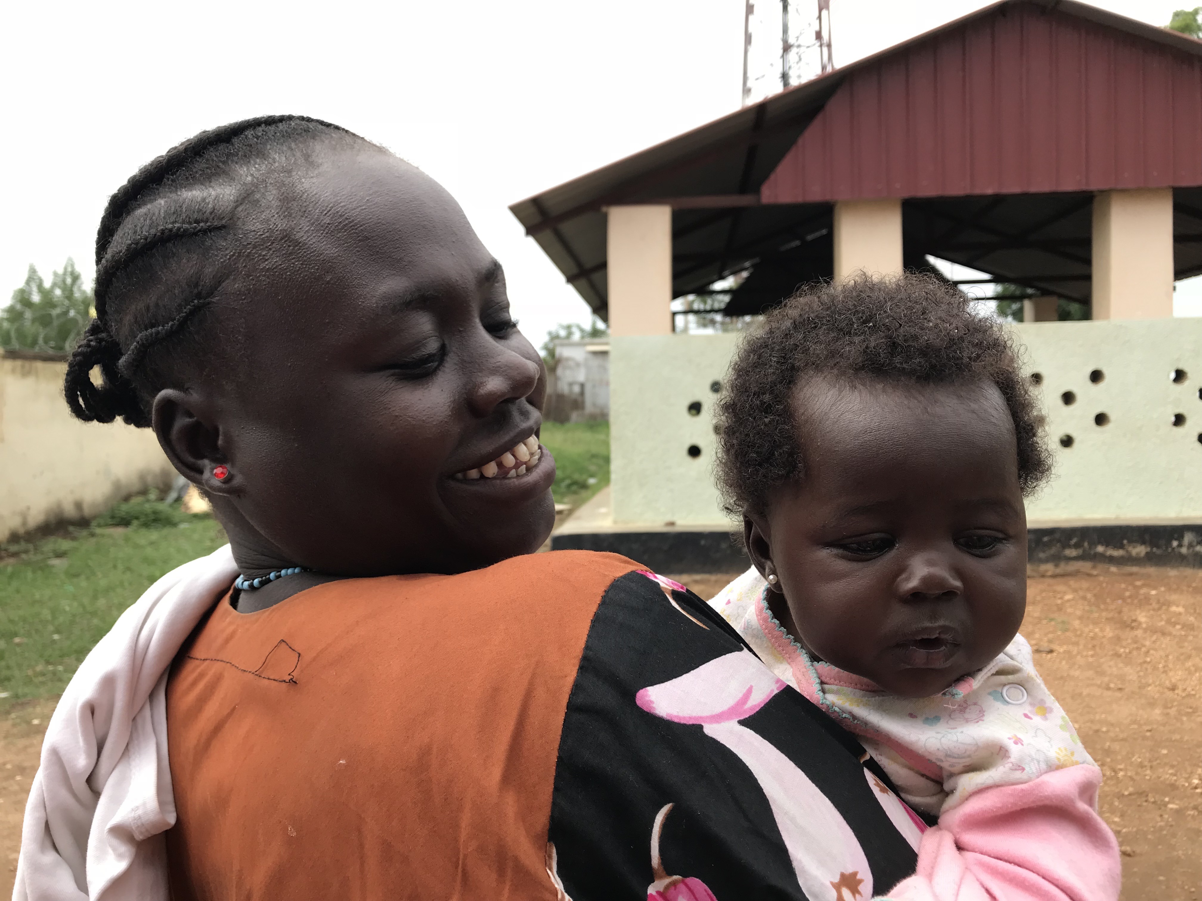 Sabiva, 35, a mother of 4 children, taking her children to the health centre
