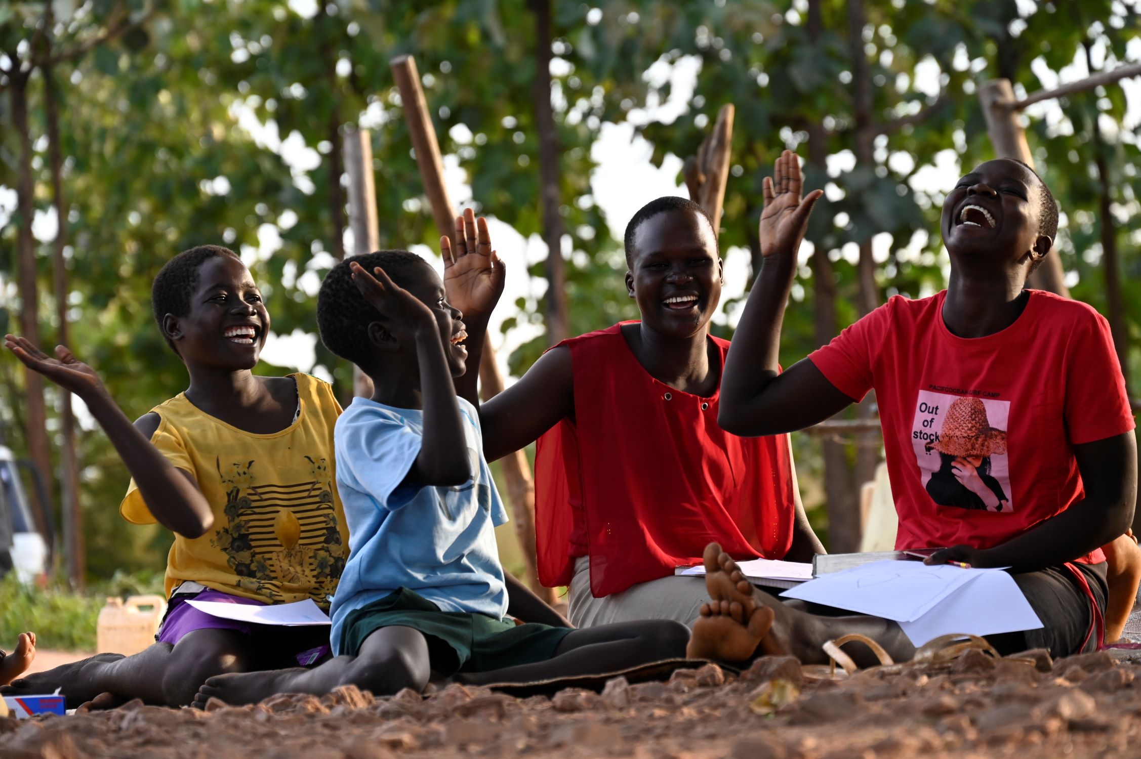 Children in Ugandan displacement camp laughing