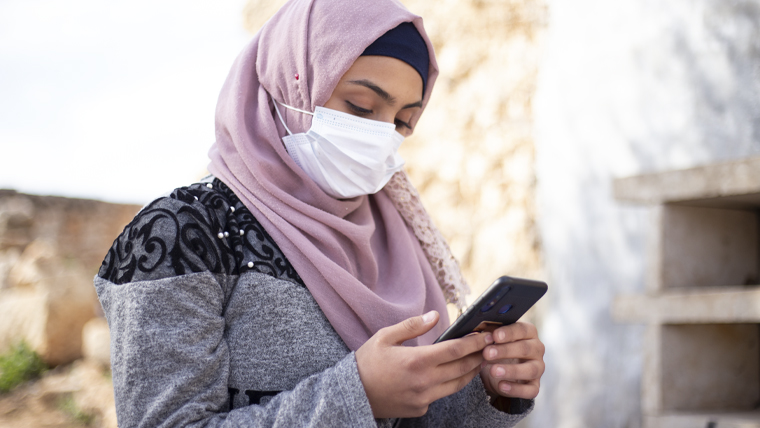 Fatimah, 18, on her mobile phone
