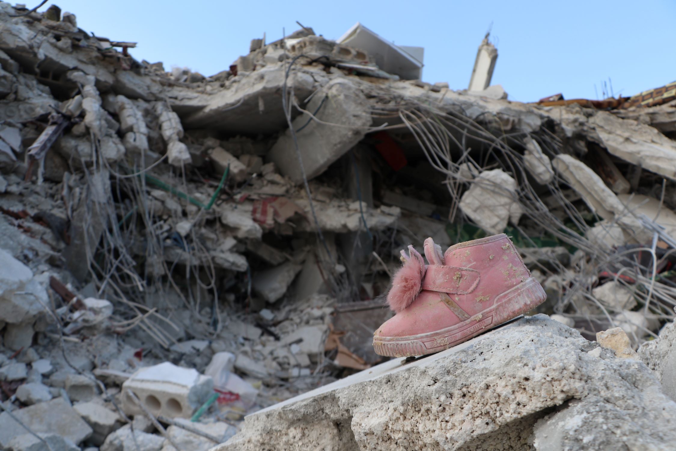A child's shoe amid the earthquake rubble in Syria