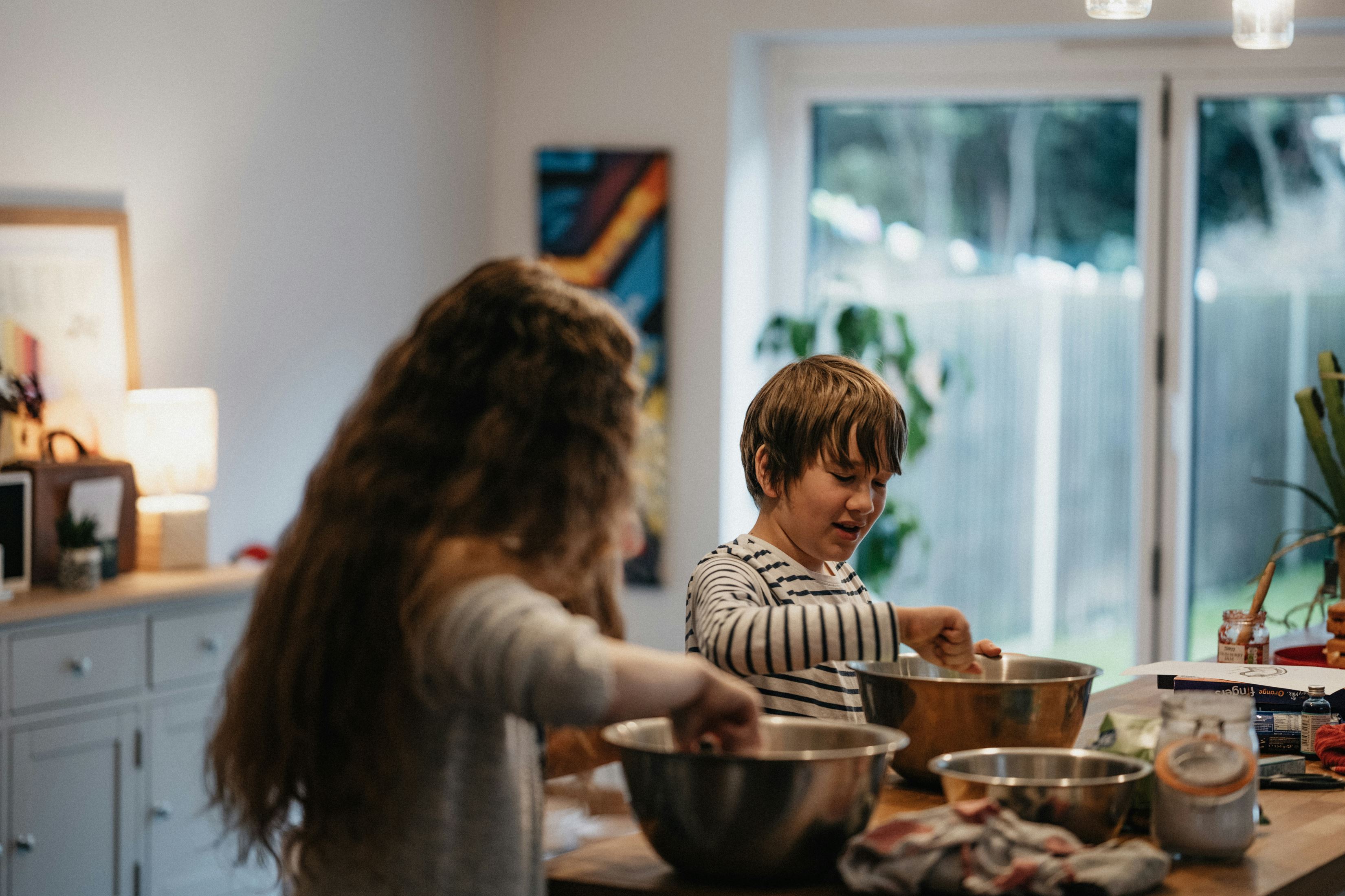 Two children baking together
