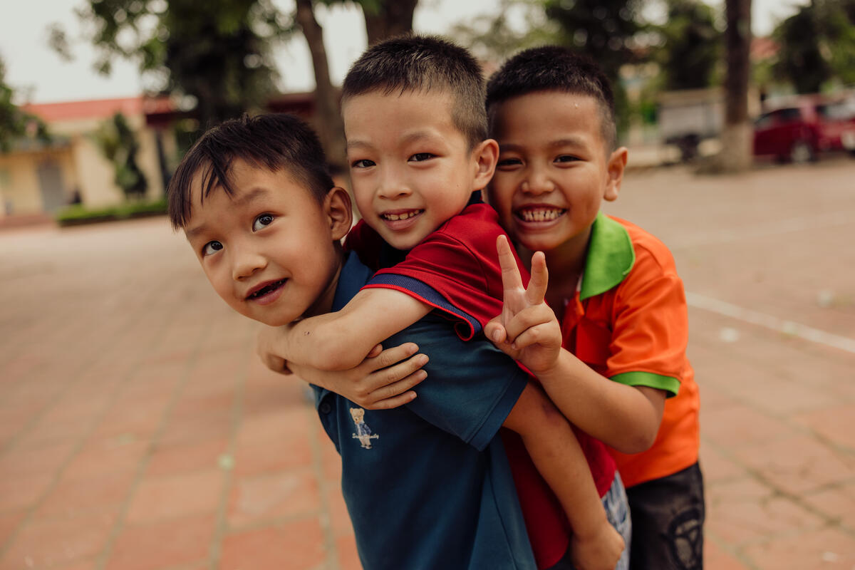 Three smiling boys in Vietnam
