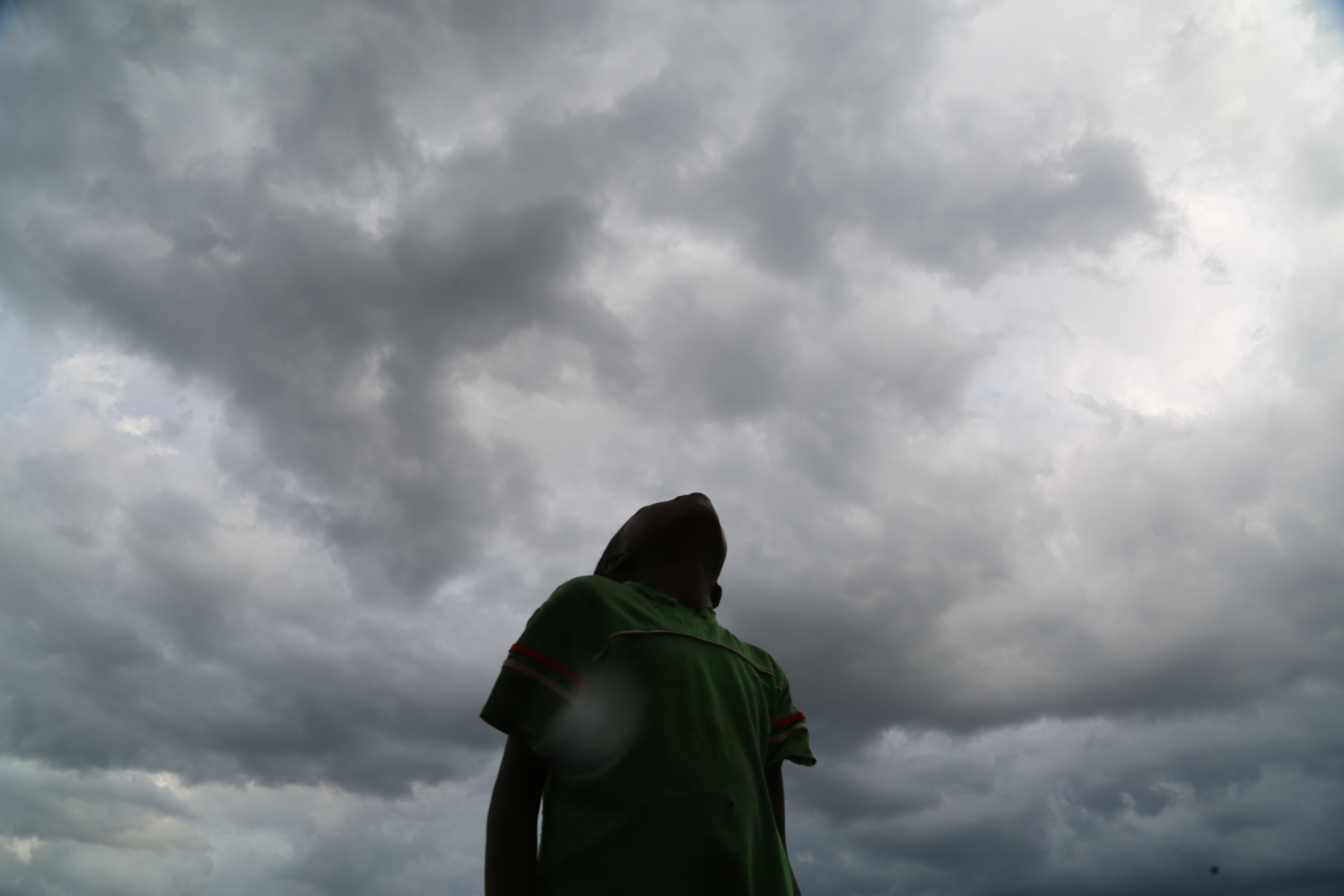 Child looking into sky