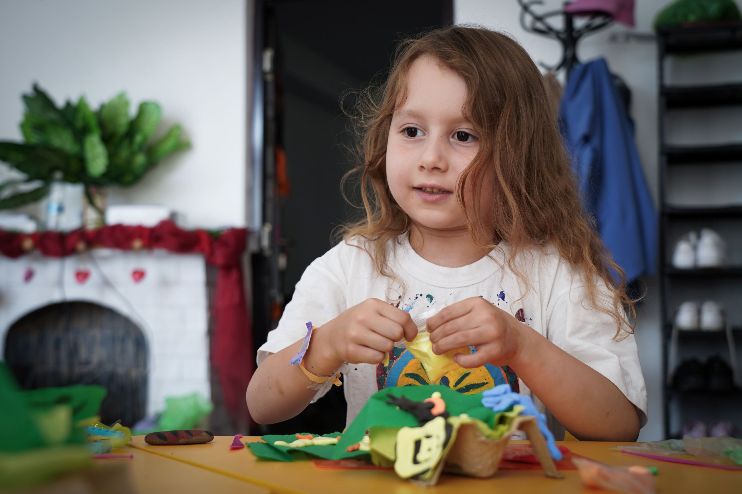 Solomia, 6, enjoys creating artwork at a child friend space in Ukraine