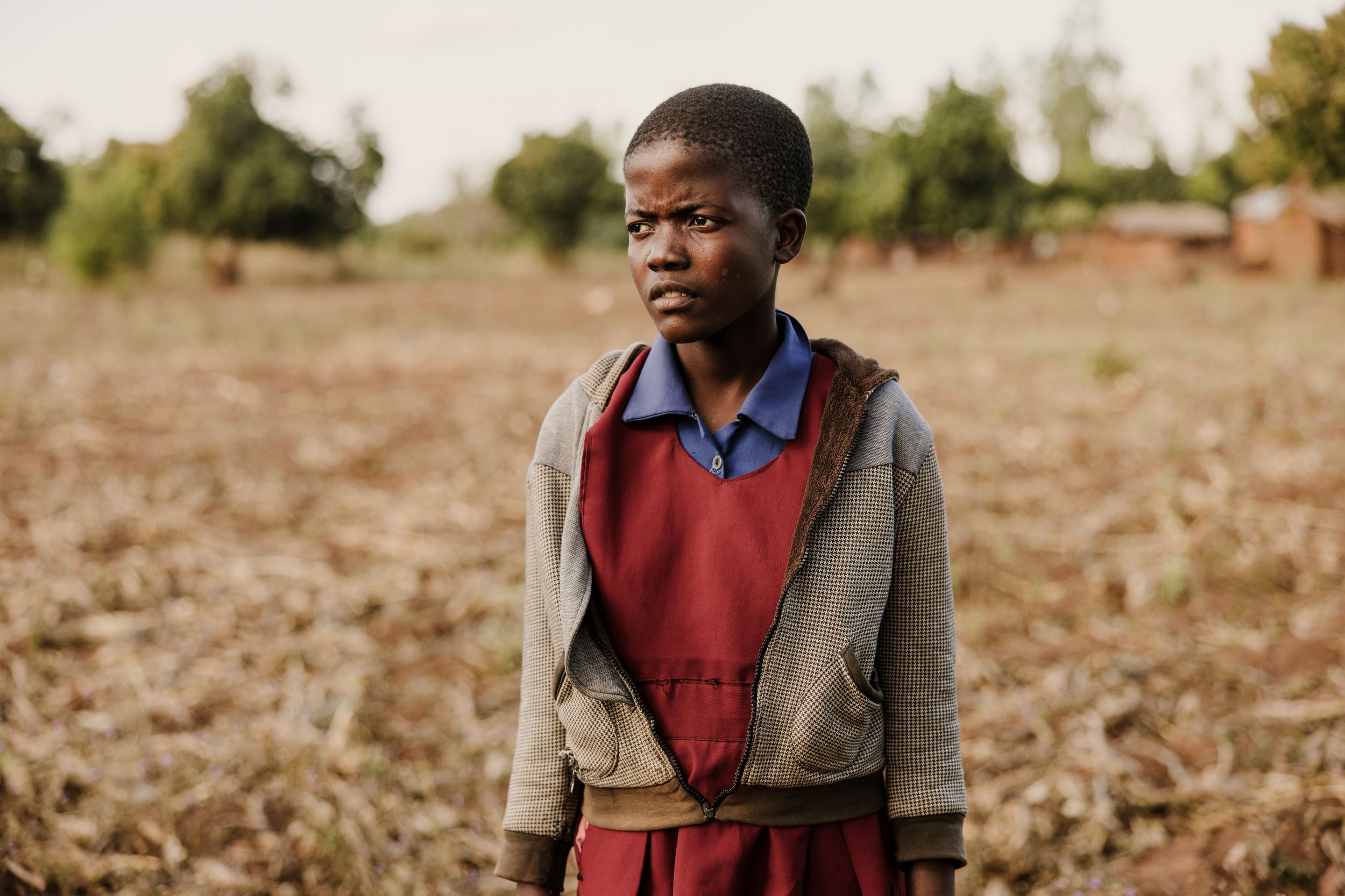 Young Malawi girls standing in a field 