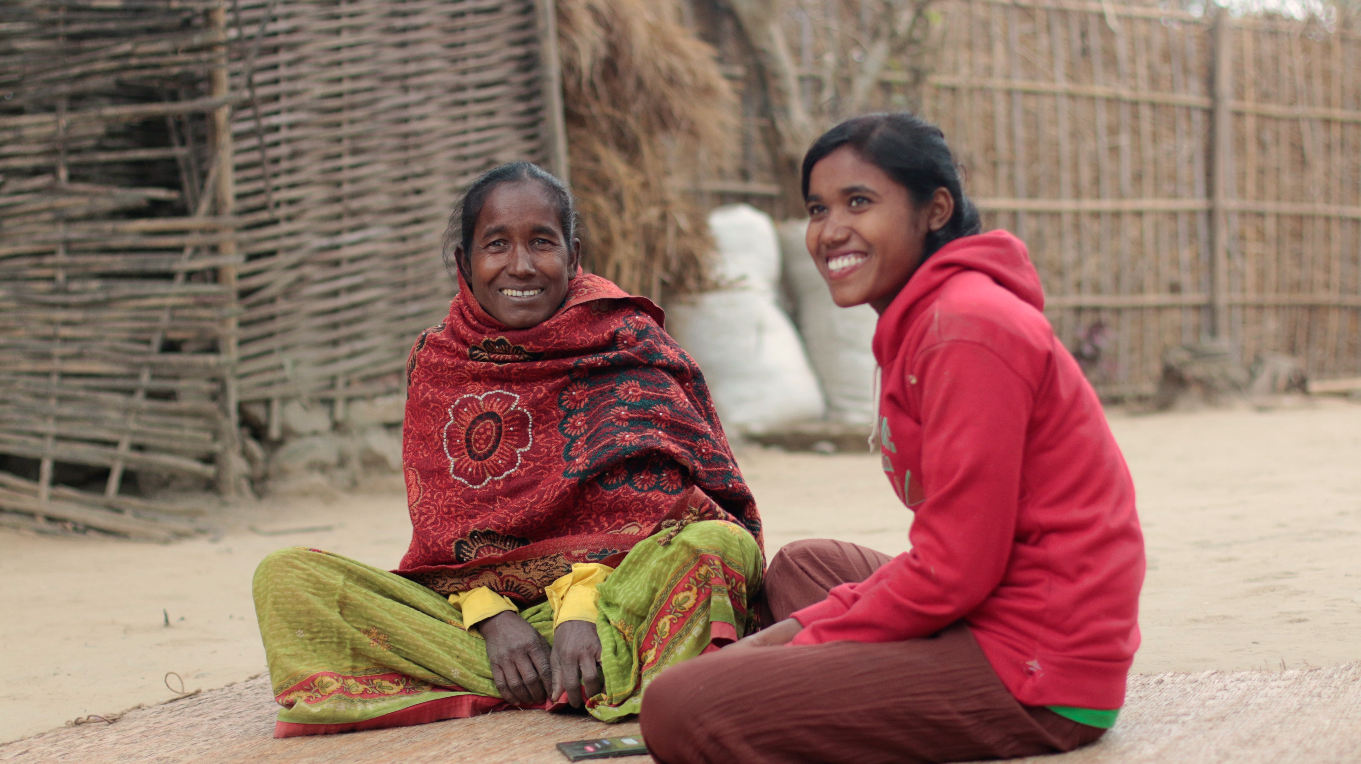 Mother and daughter sitting on the floor together