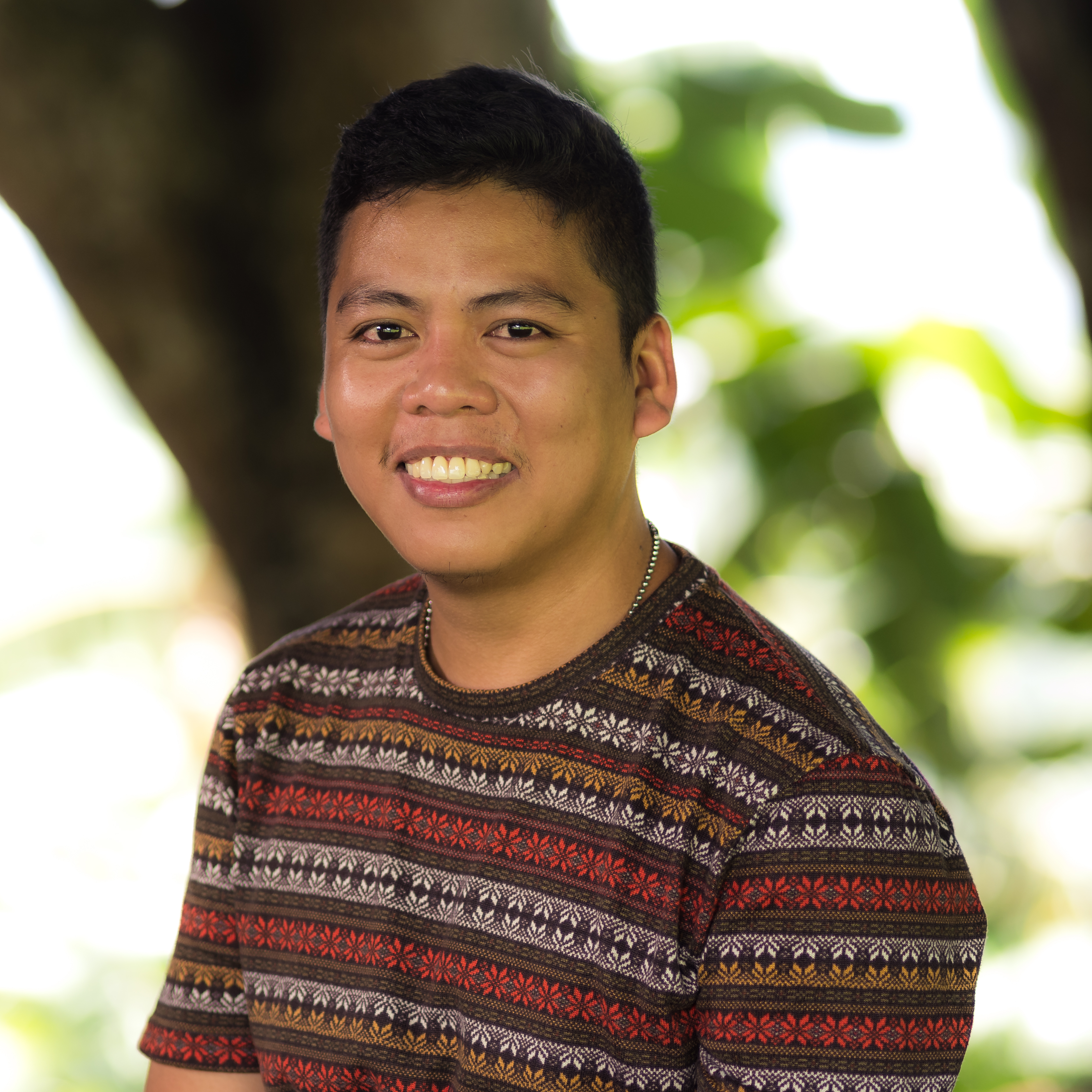 Janvie, now a young man, smiles 