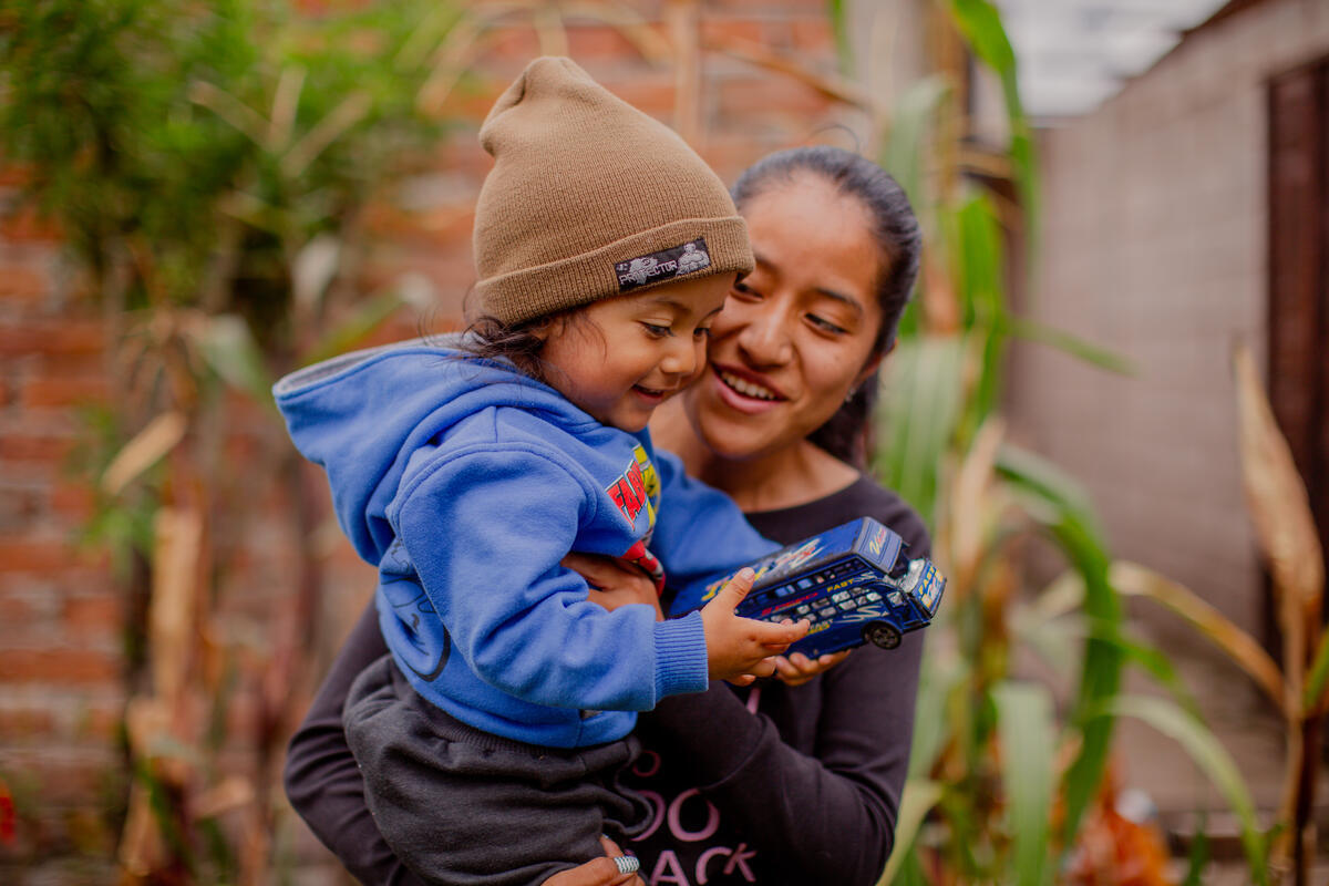 A mother and child, growing fresh fruit and vegetables for all the family to thrive