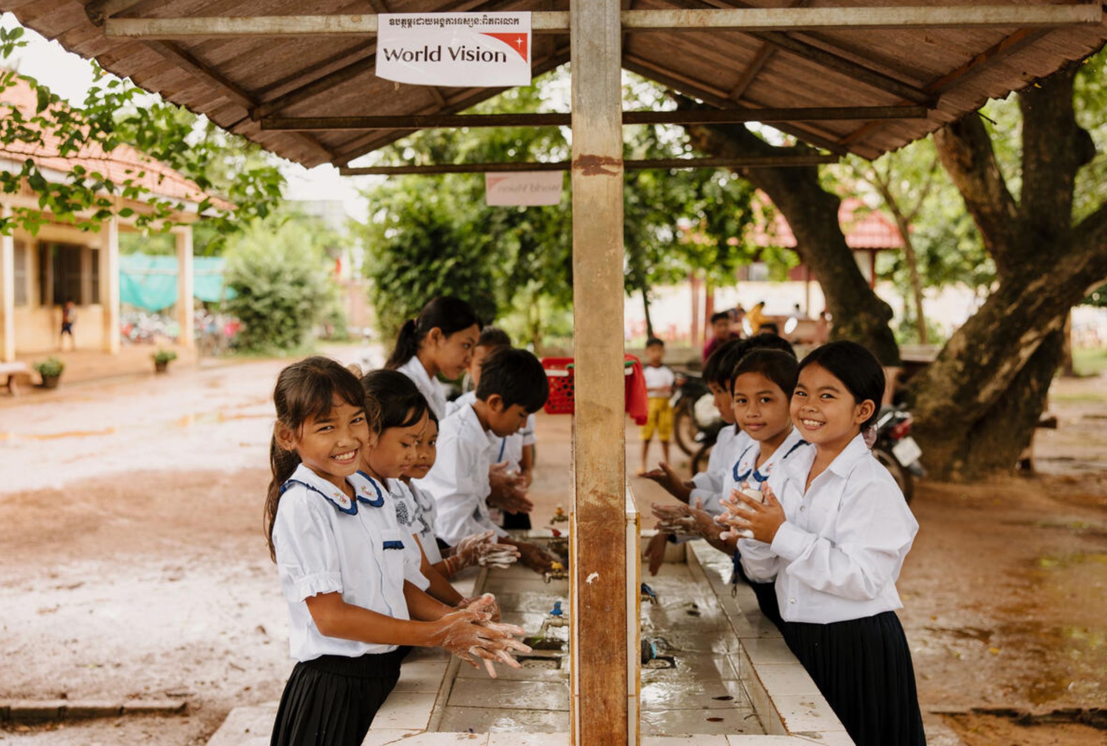 Cambodian school children washing their hands
