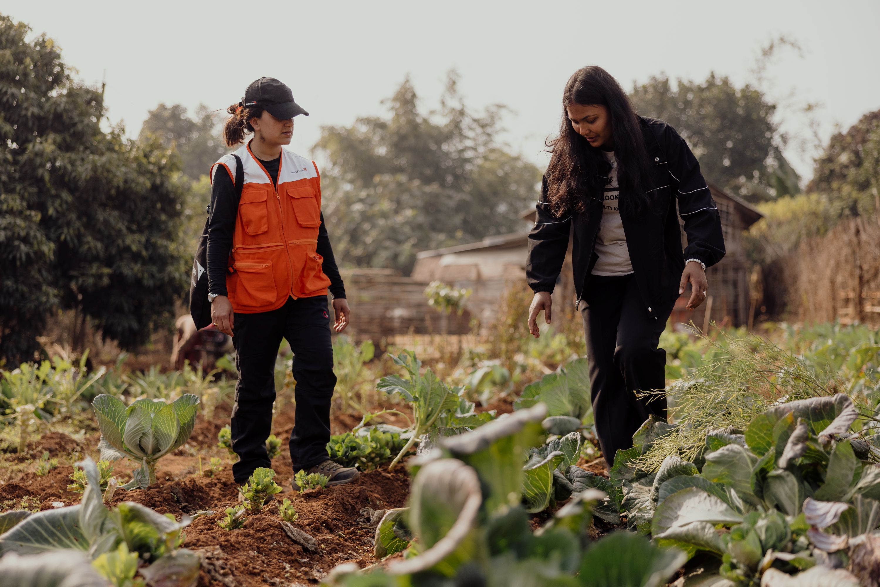 Januka inspecting the nutritious seasonal vegetables in her vegetable garden