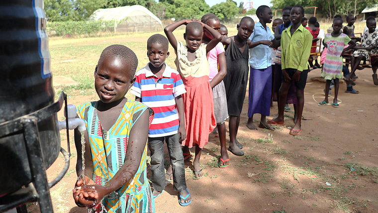 A line of people in South Sudan queuing to wash their hands