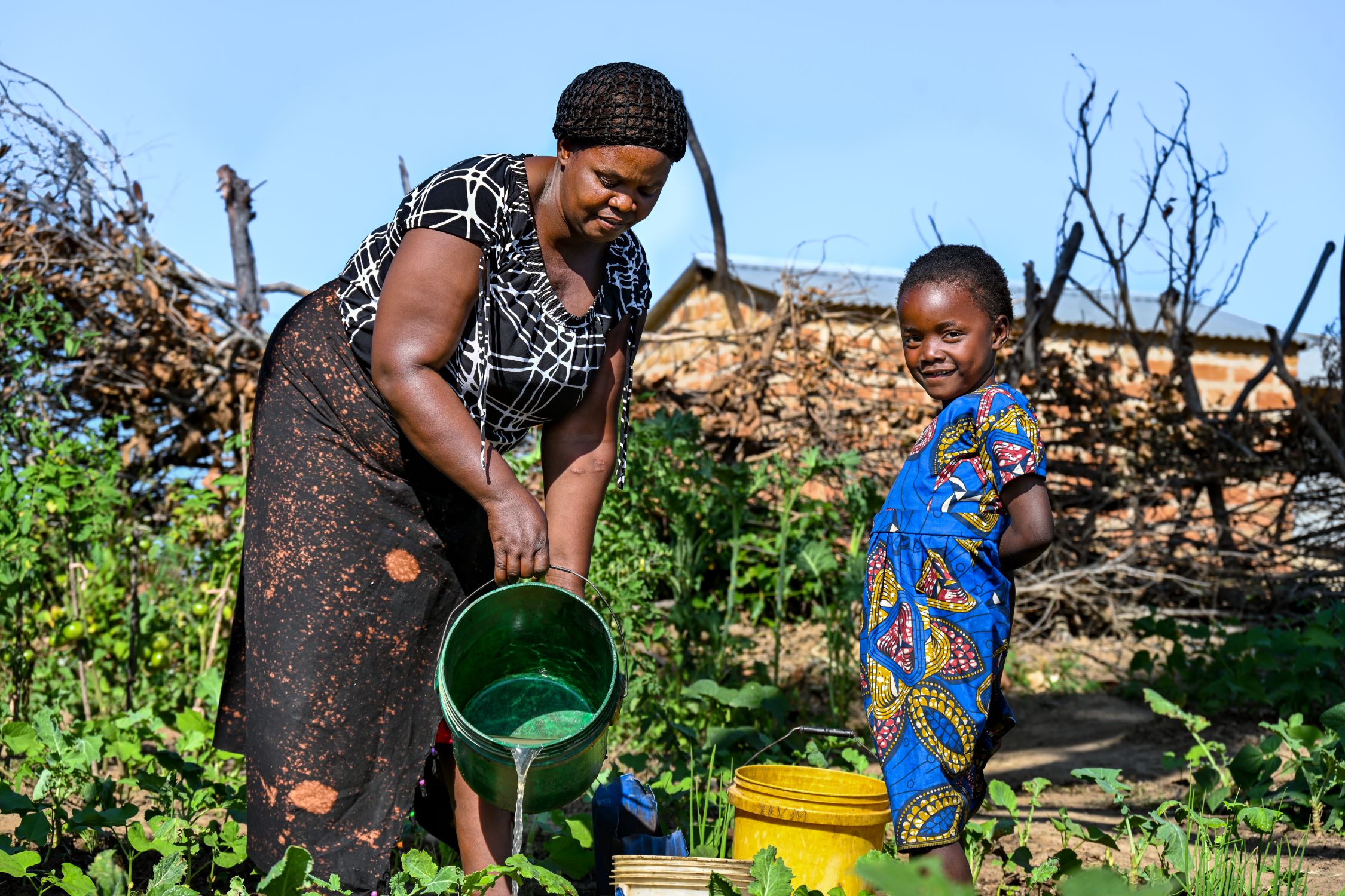 Zambia mother and daughter gardening