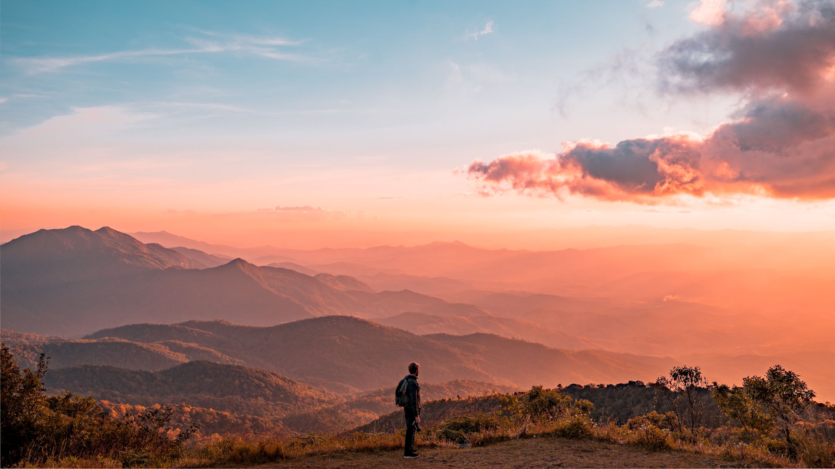 Man looking out at the sunset
