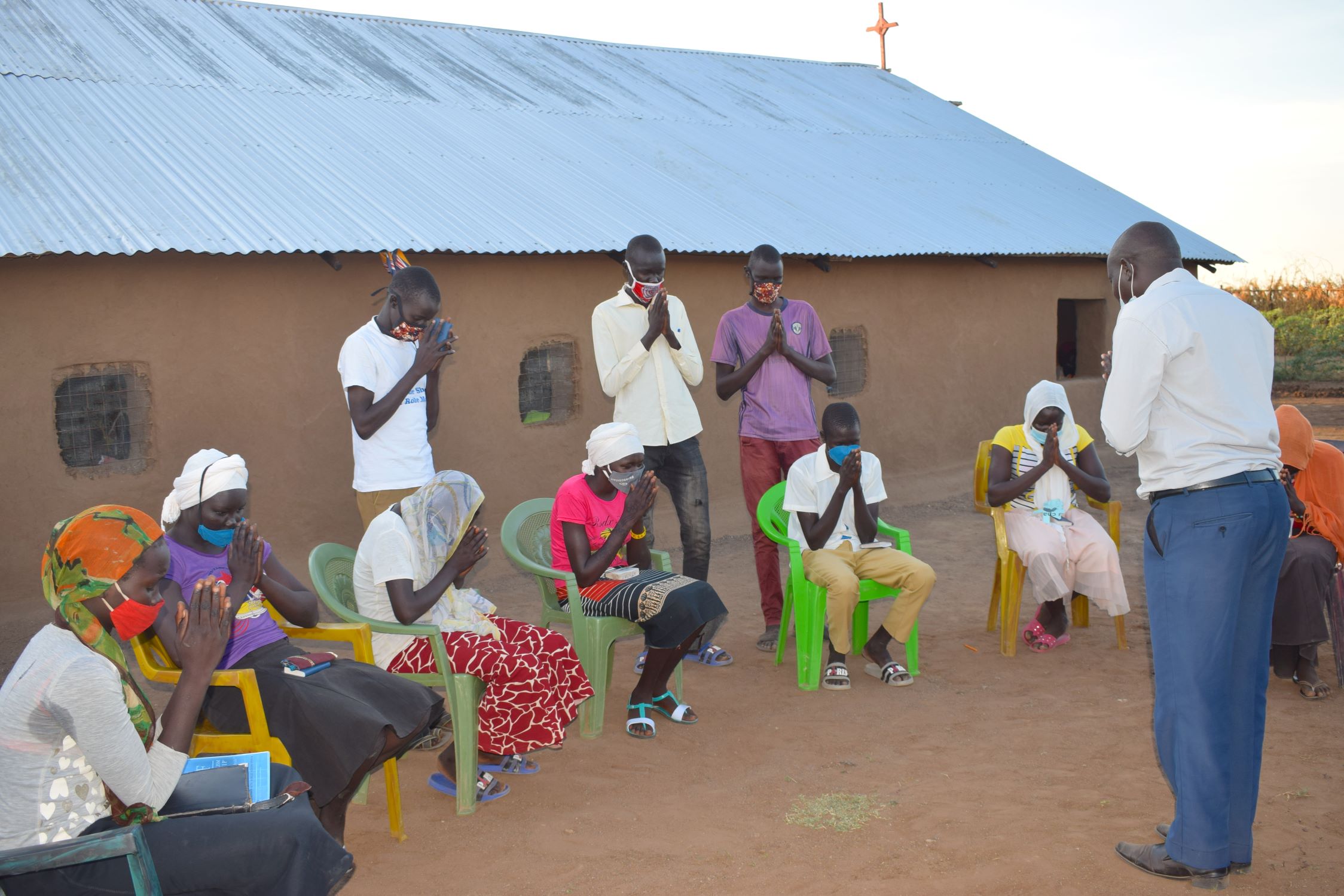 A Kenyan Bible club praying together