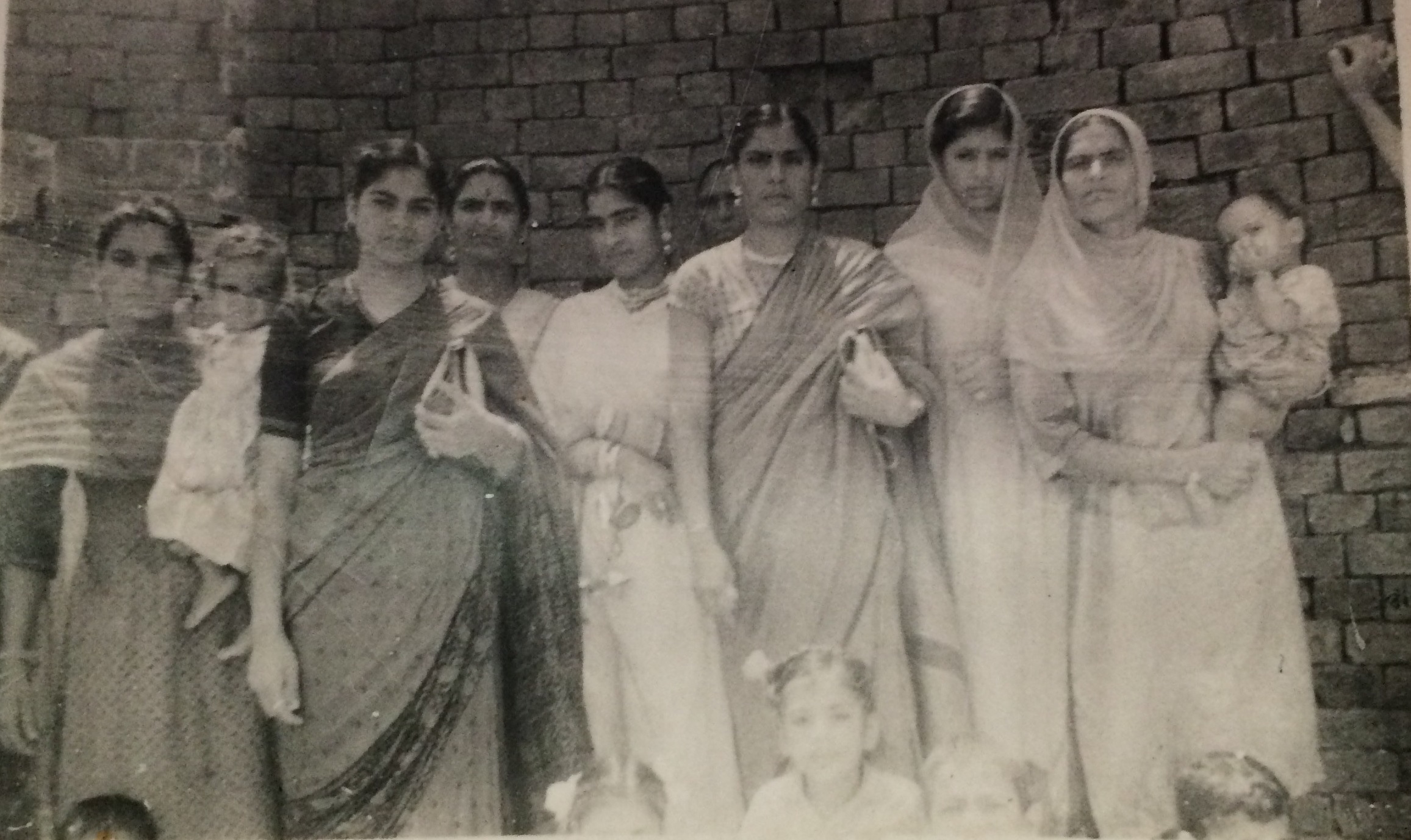 black and white photo of Motia and her family in India