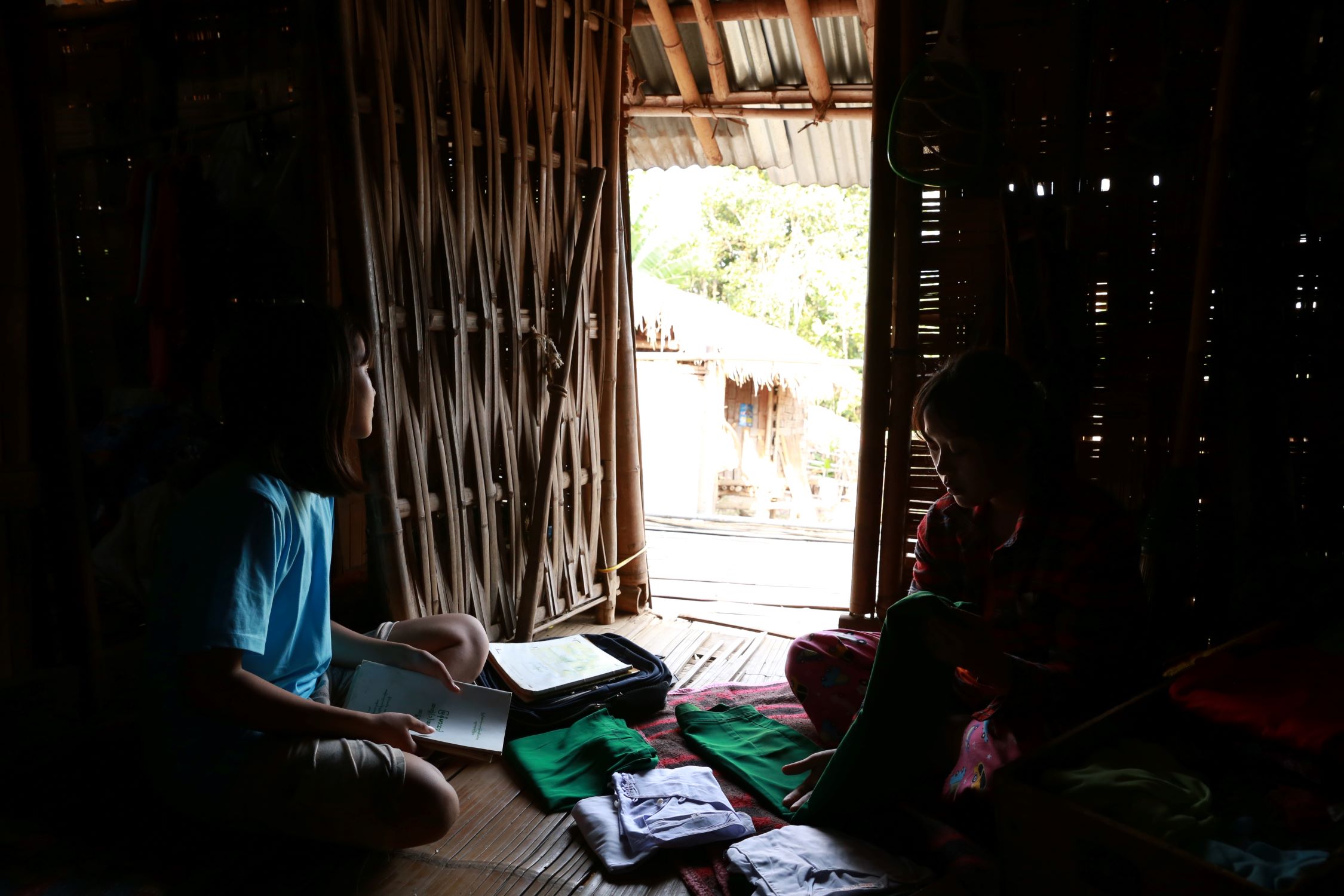 Two girls sitting and studying