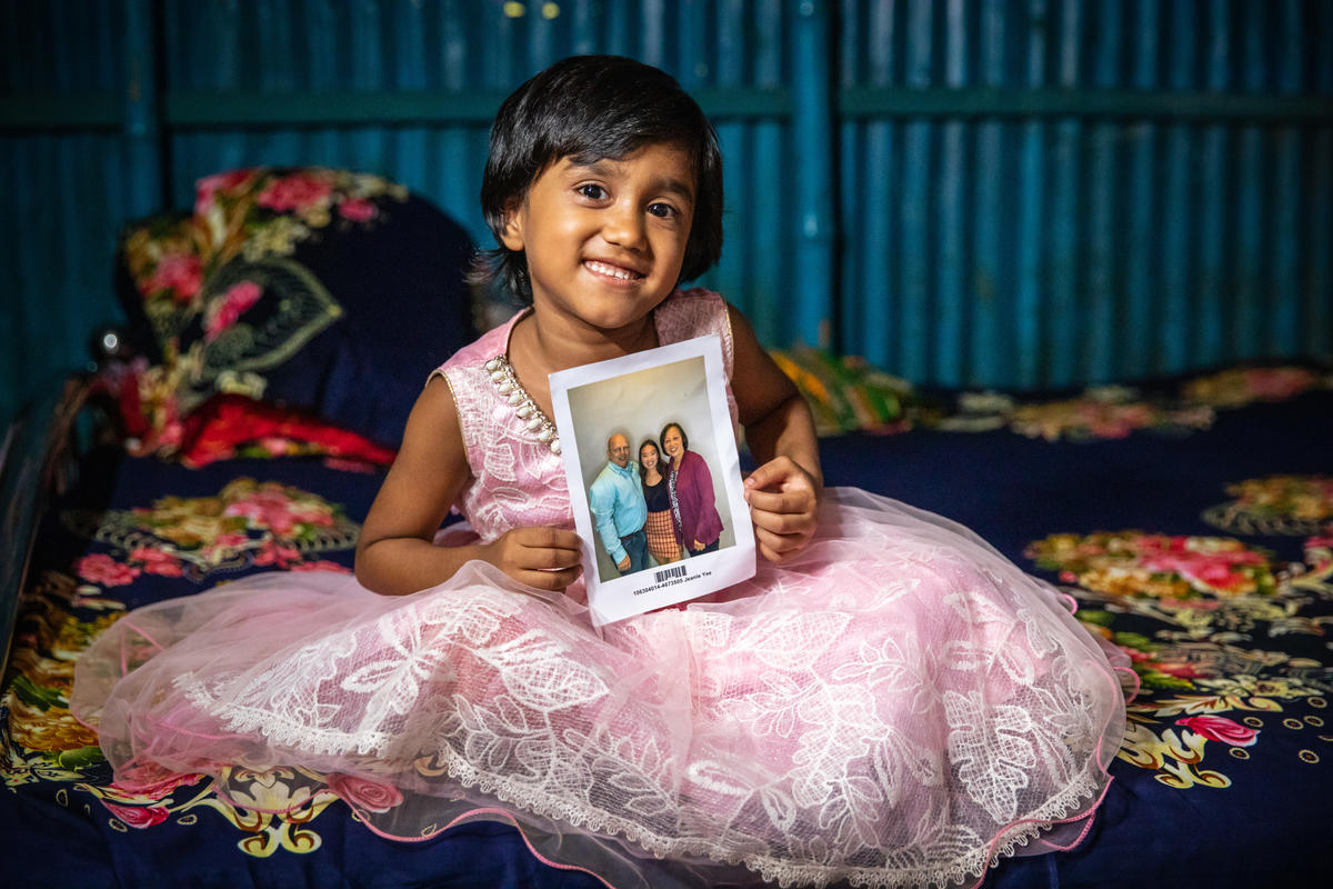 Milli with a photo of her chosen sponsors
