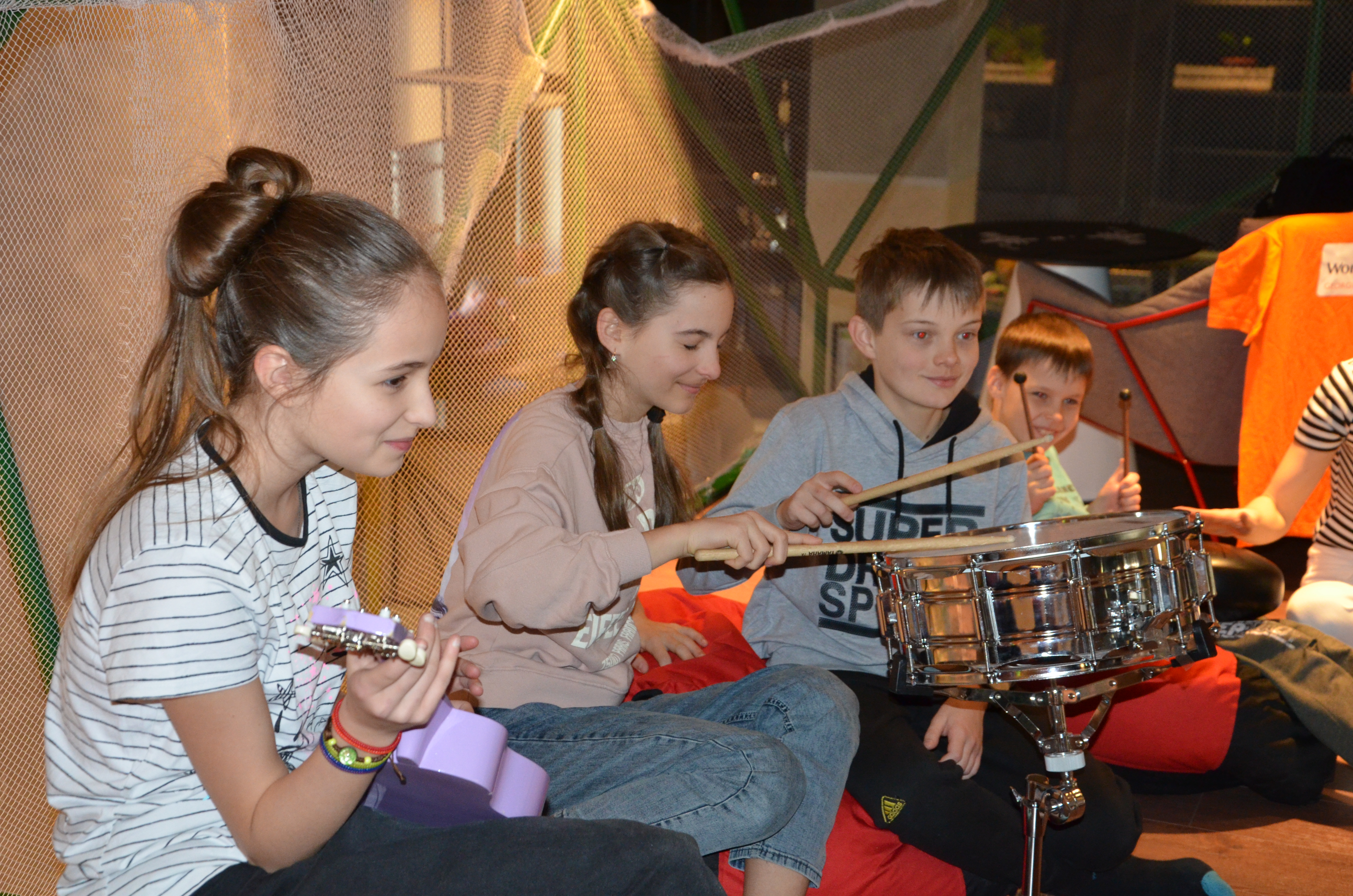 children take part in music therapy