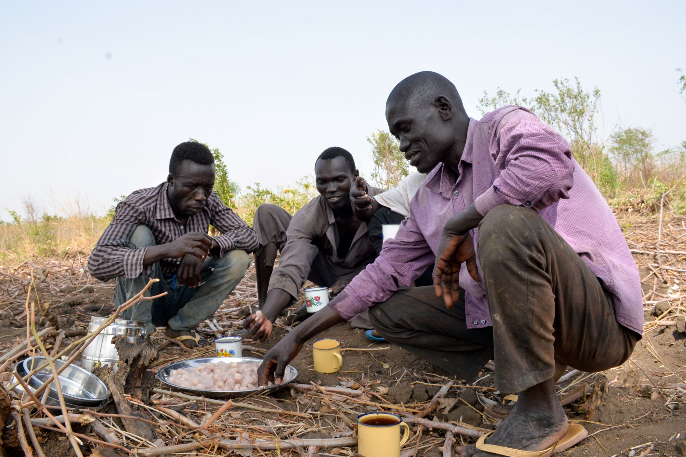Refugees in Uganda sharing a meal