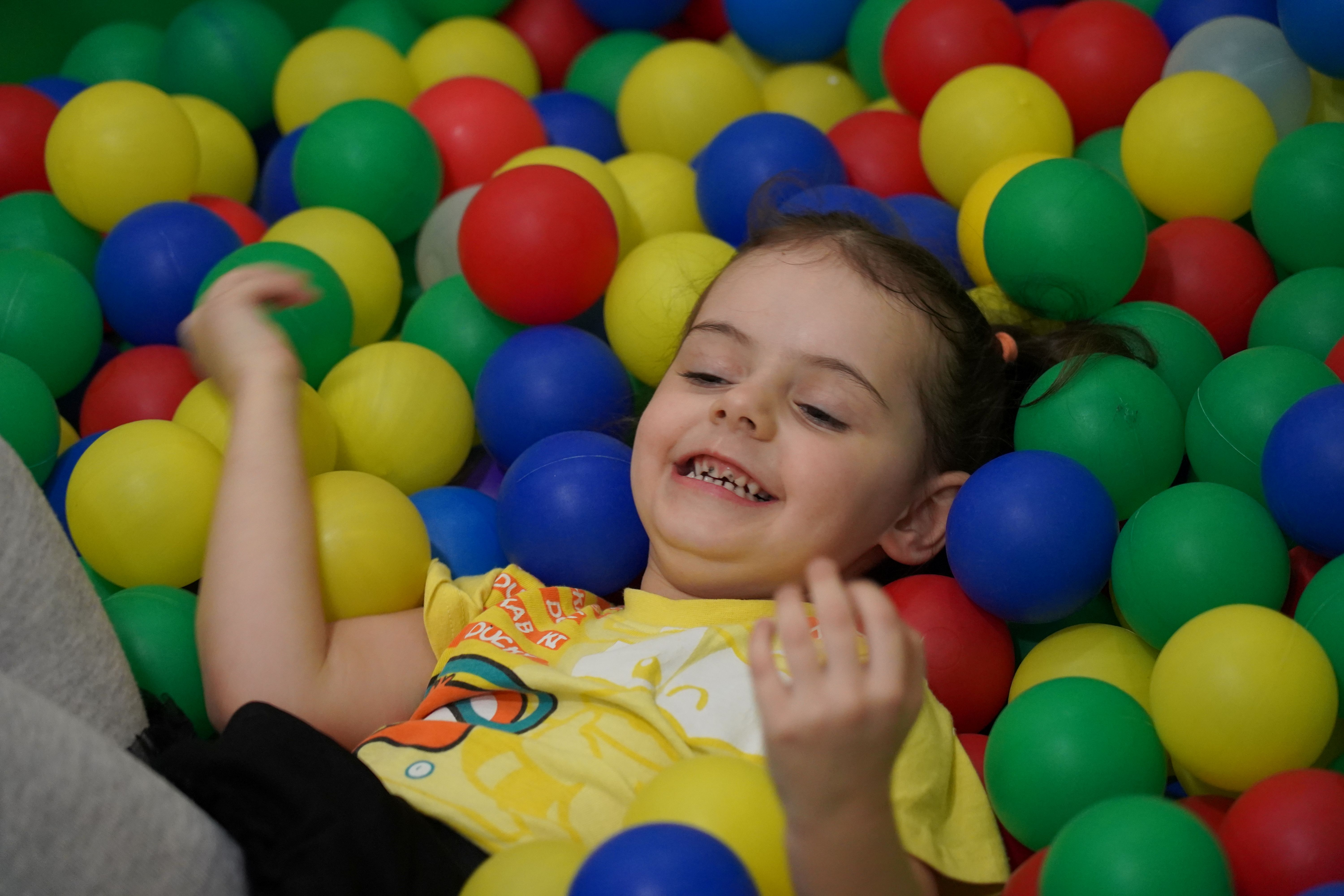 Arina has so much fun playing in the colourful ball pit and taking part in other activities at a child friendly space