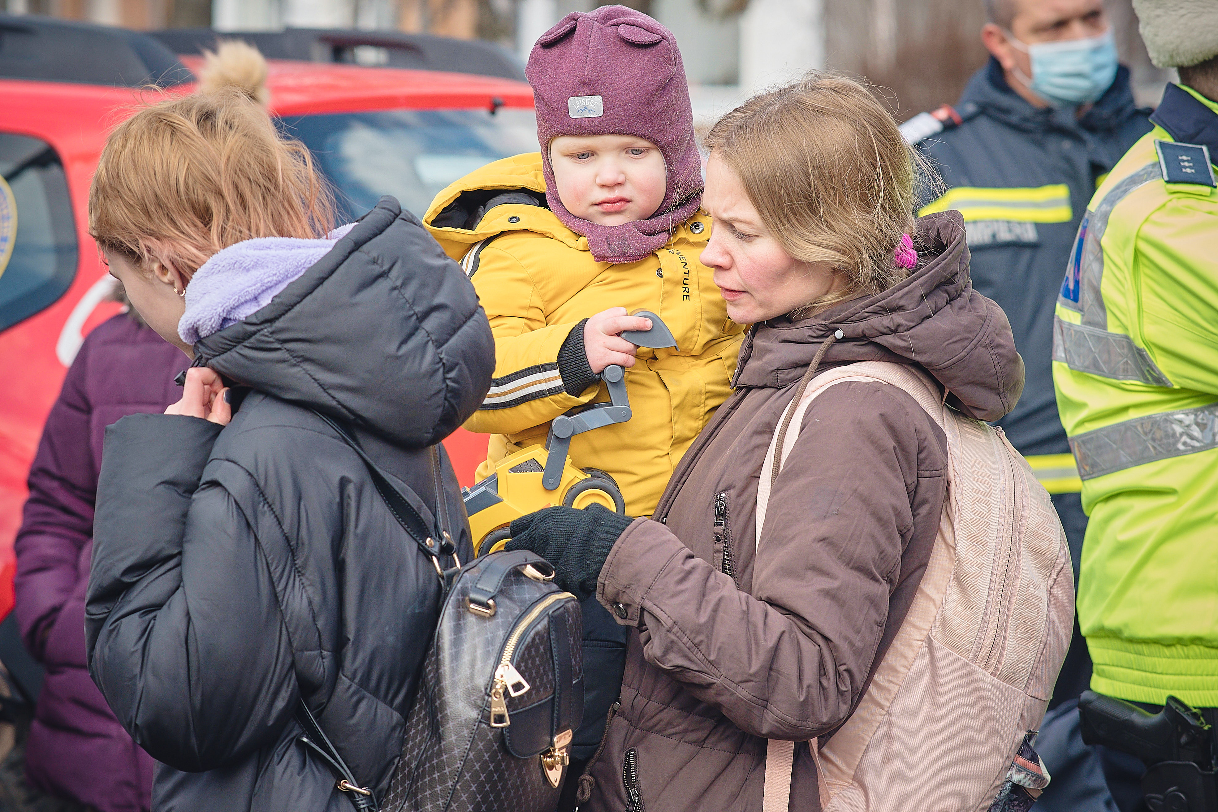 Refugees crossing the border into Romania, many of them children