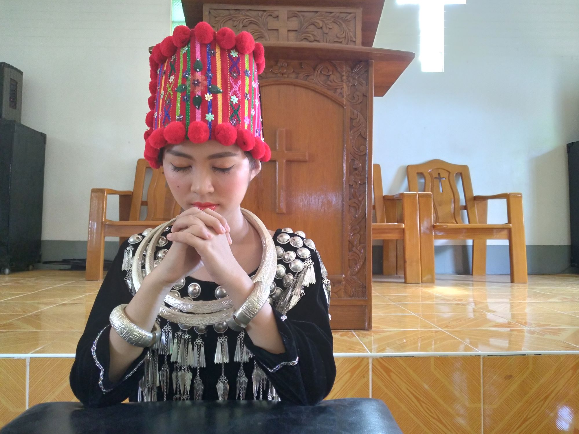 Hser, from Myanmar, prays