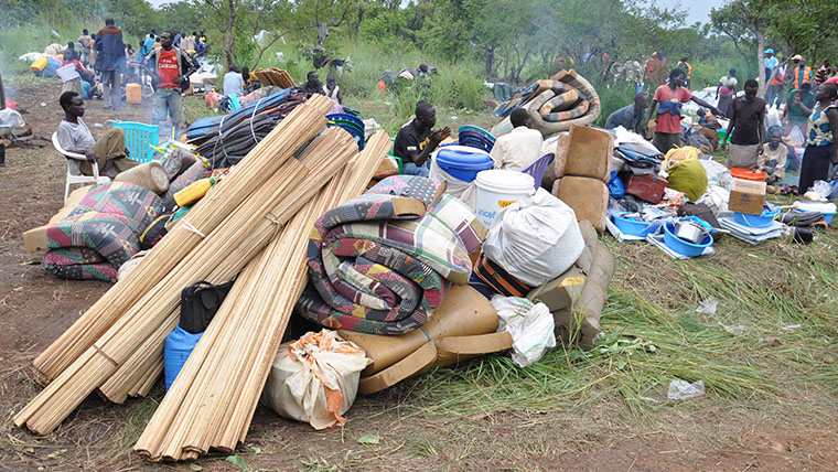 Shelter items for refugees to use, including tarpaulin and mattresses 