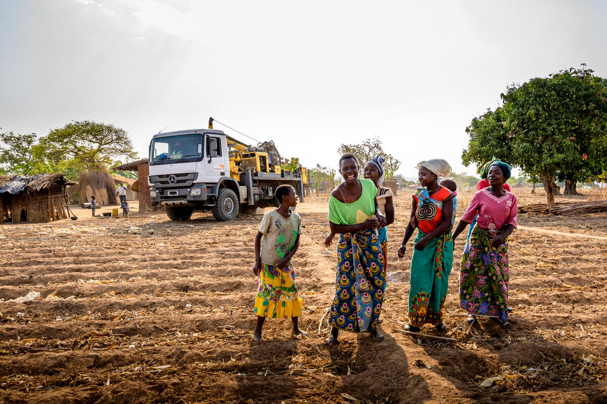 A community are excited to watch as their new borehole is installed