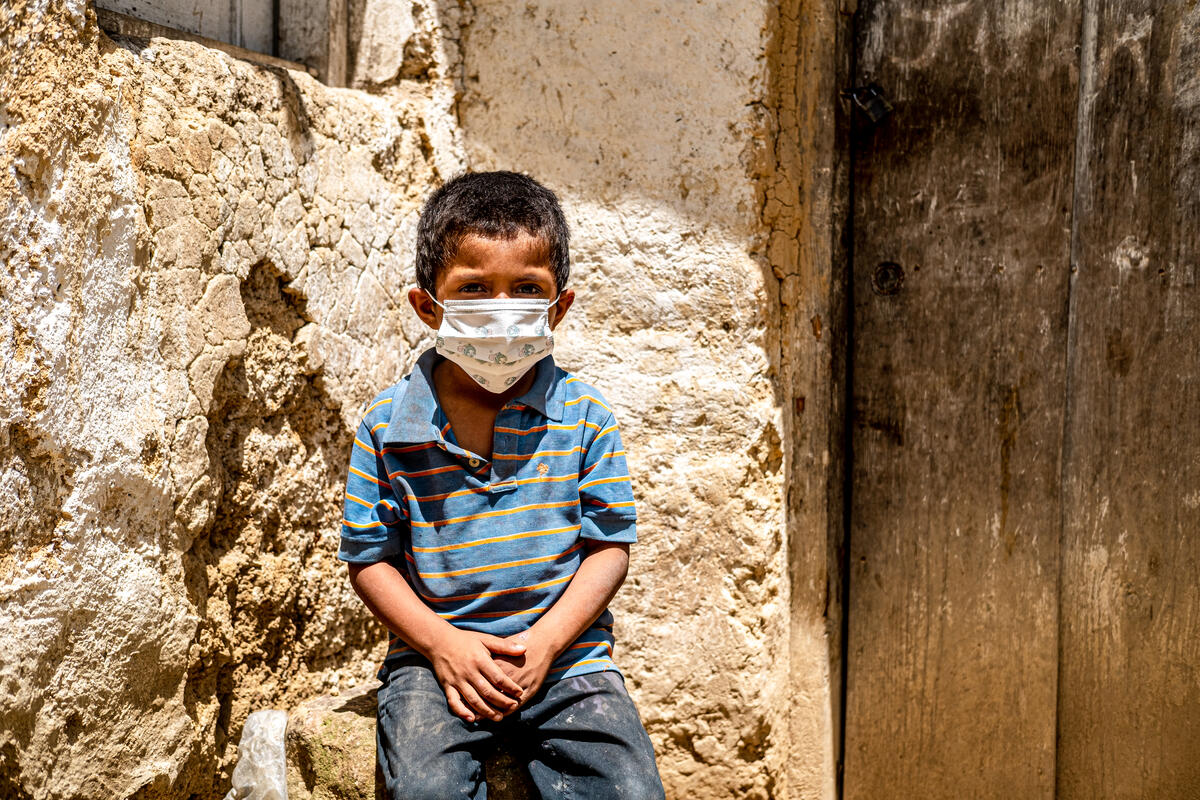 Little boy wears a mask in Honduras