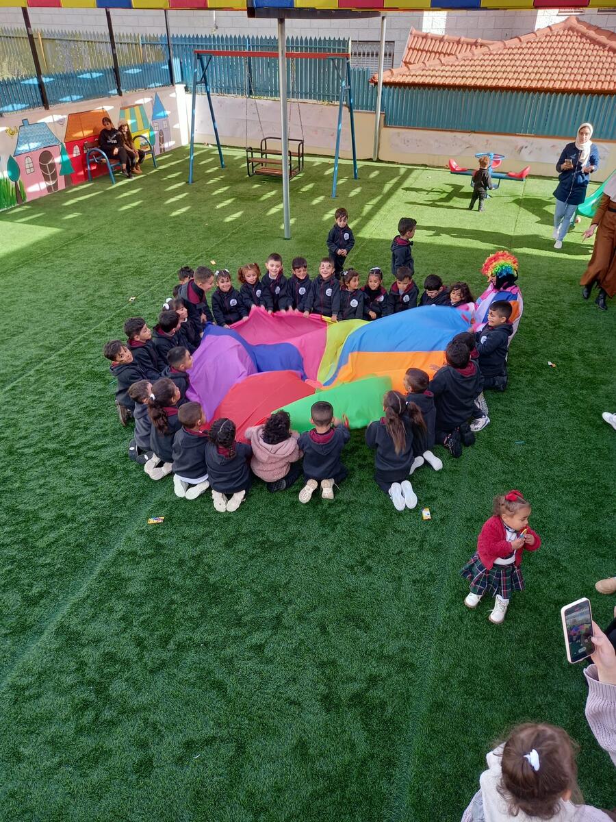 An overhead shot of children laying closely together