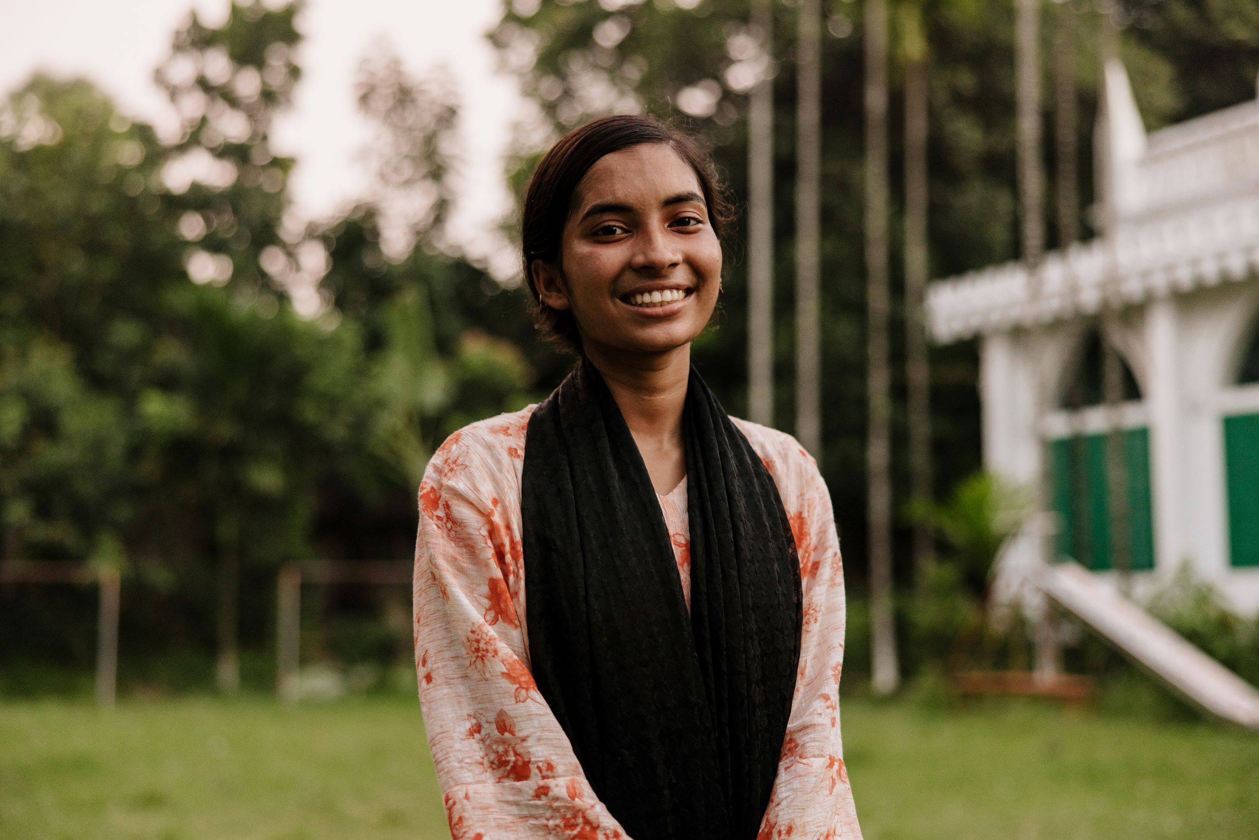 Smiling sponsored Bangladeshi girl