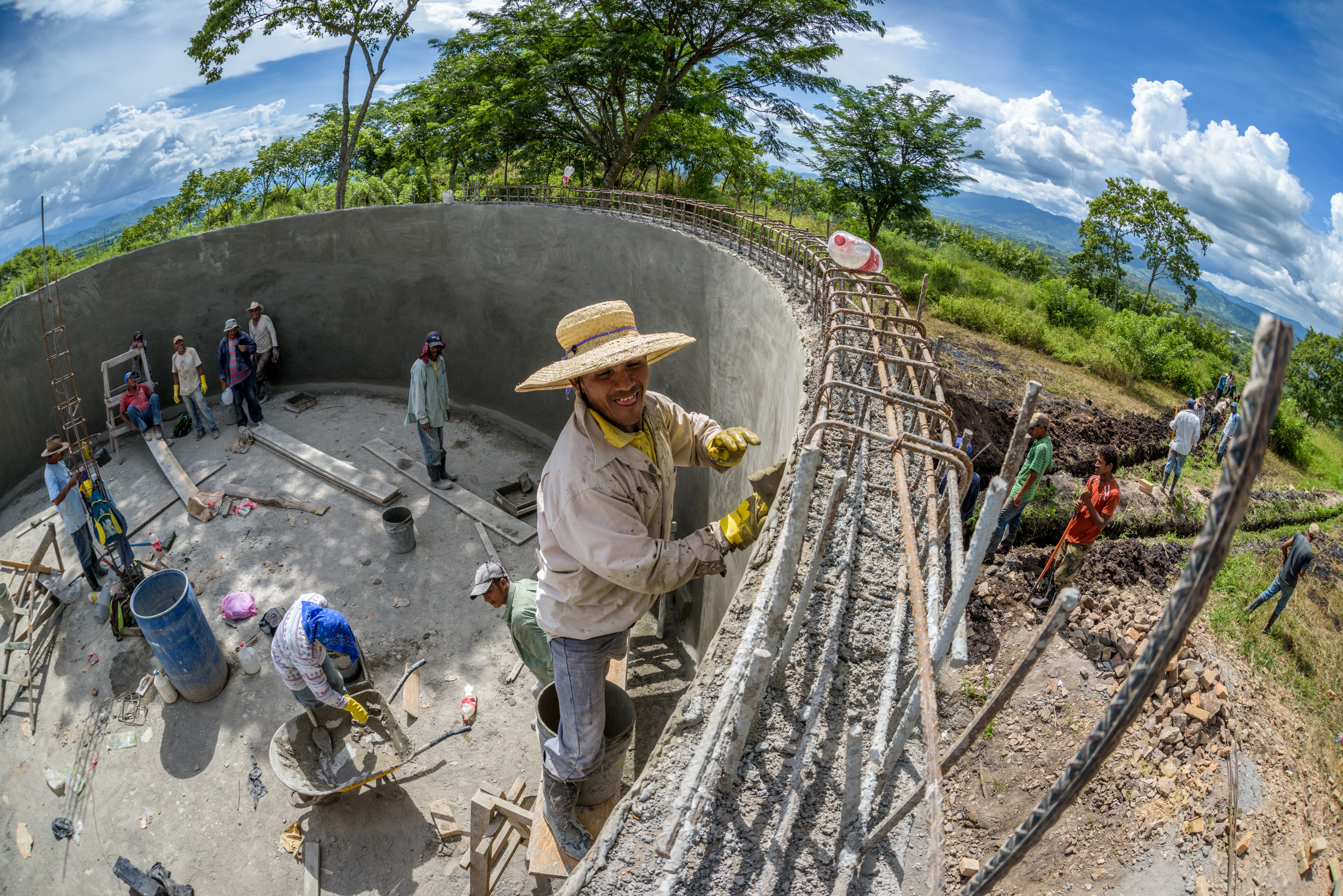 Construction workers work on a reservoir in Honduras