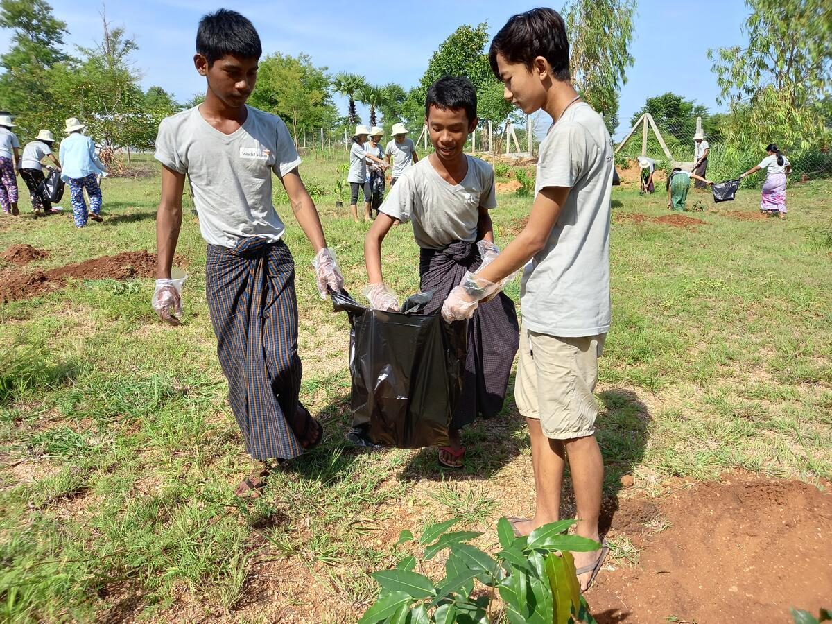 School children help to plant trees in Myanmar