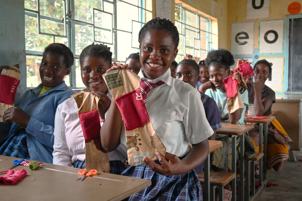 A girl in Zambia learning how to make reusable sanitary pads