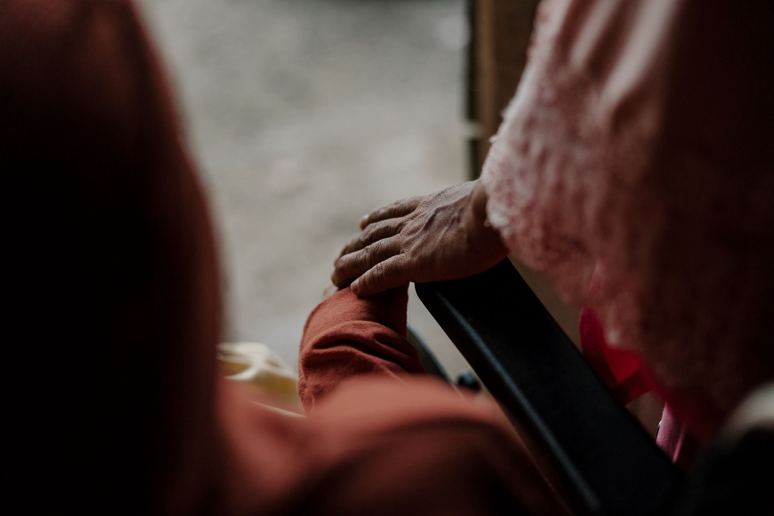 A mother holds her daughter’s hand 